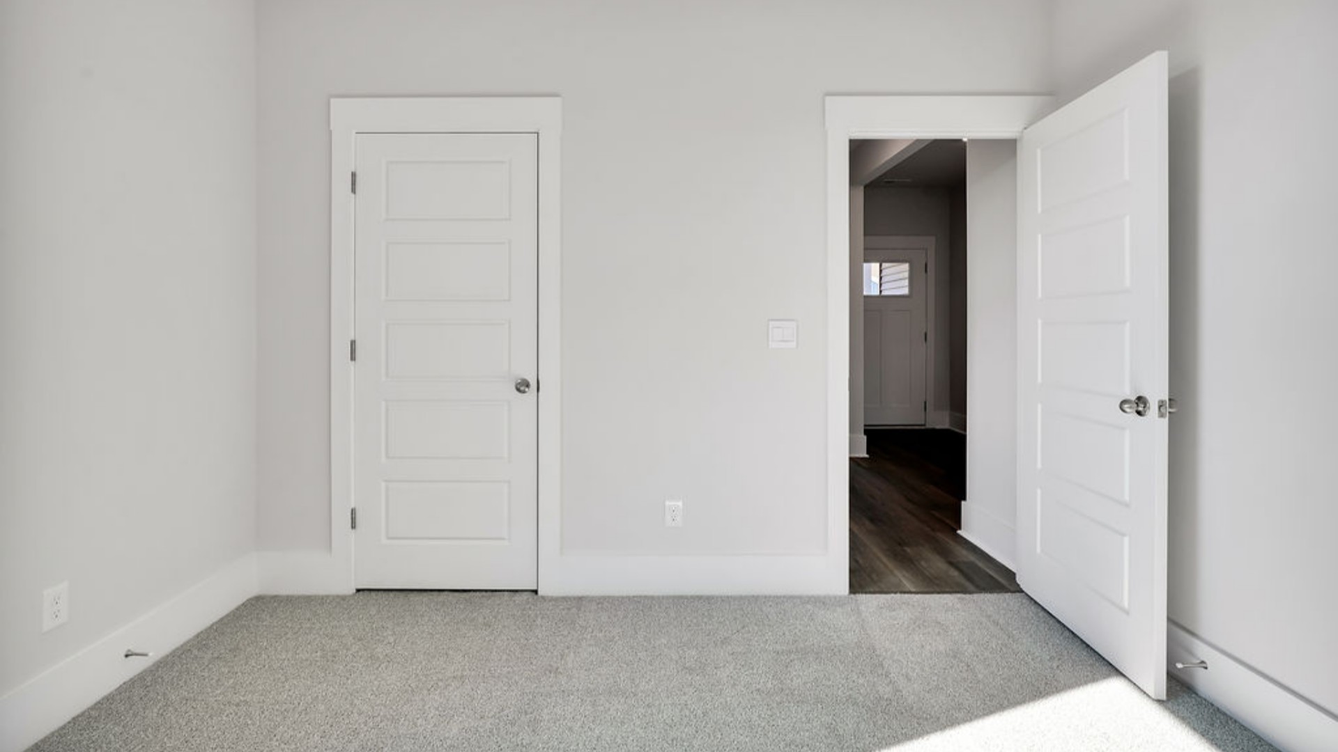 As you make your way off the front porch, a foyer leads you into the heart of the home. Two bedrooms sit off the main foyer and share a full bathroom in the middle.