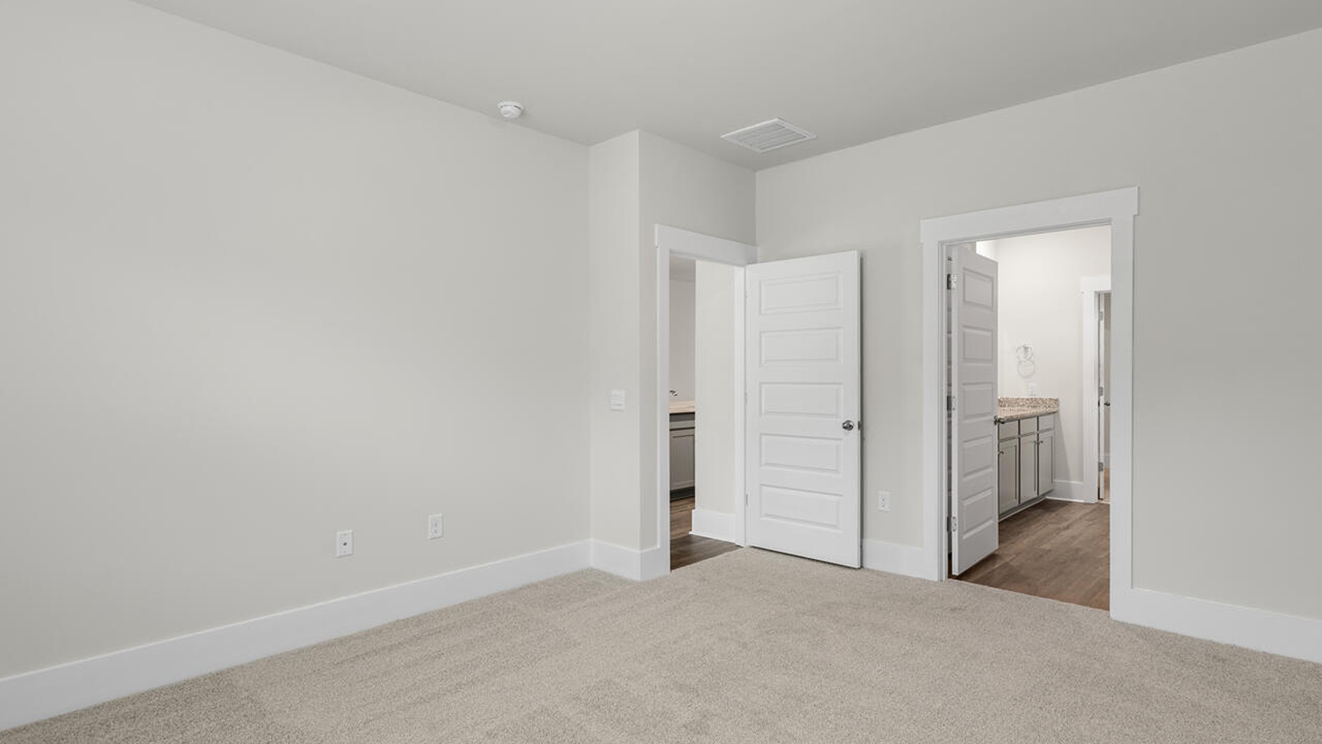 The primary bedroom has its own attached bathroom that features a walk-in closet and all the space you need to get ready in the morning.