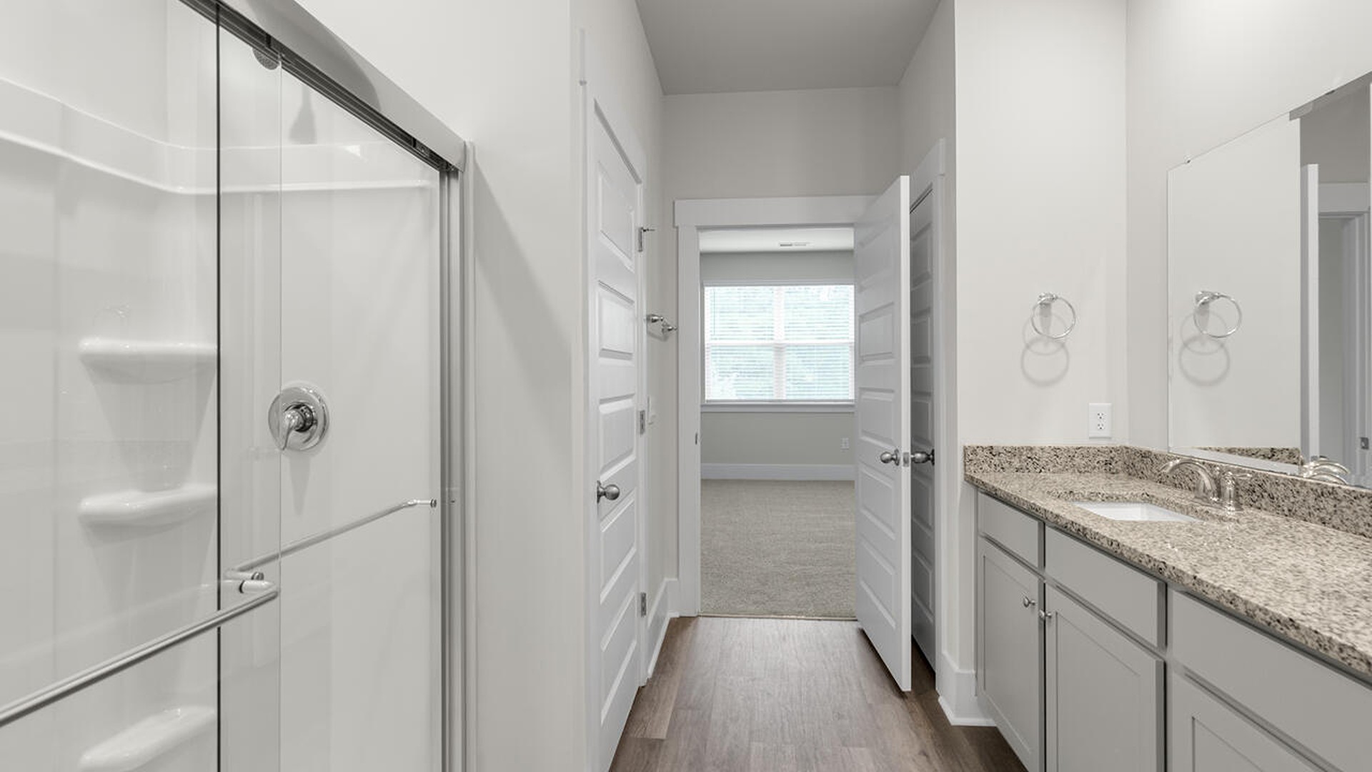 The primary bedroom has its own attached bathroom that features a walk-in closet and all the space you need to get ready in the morning.
