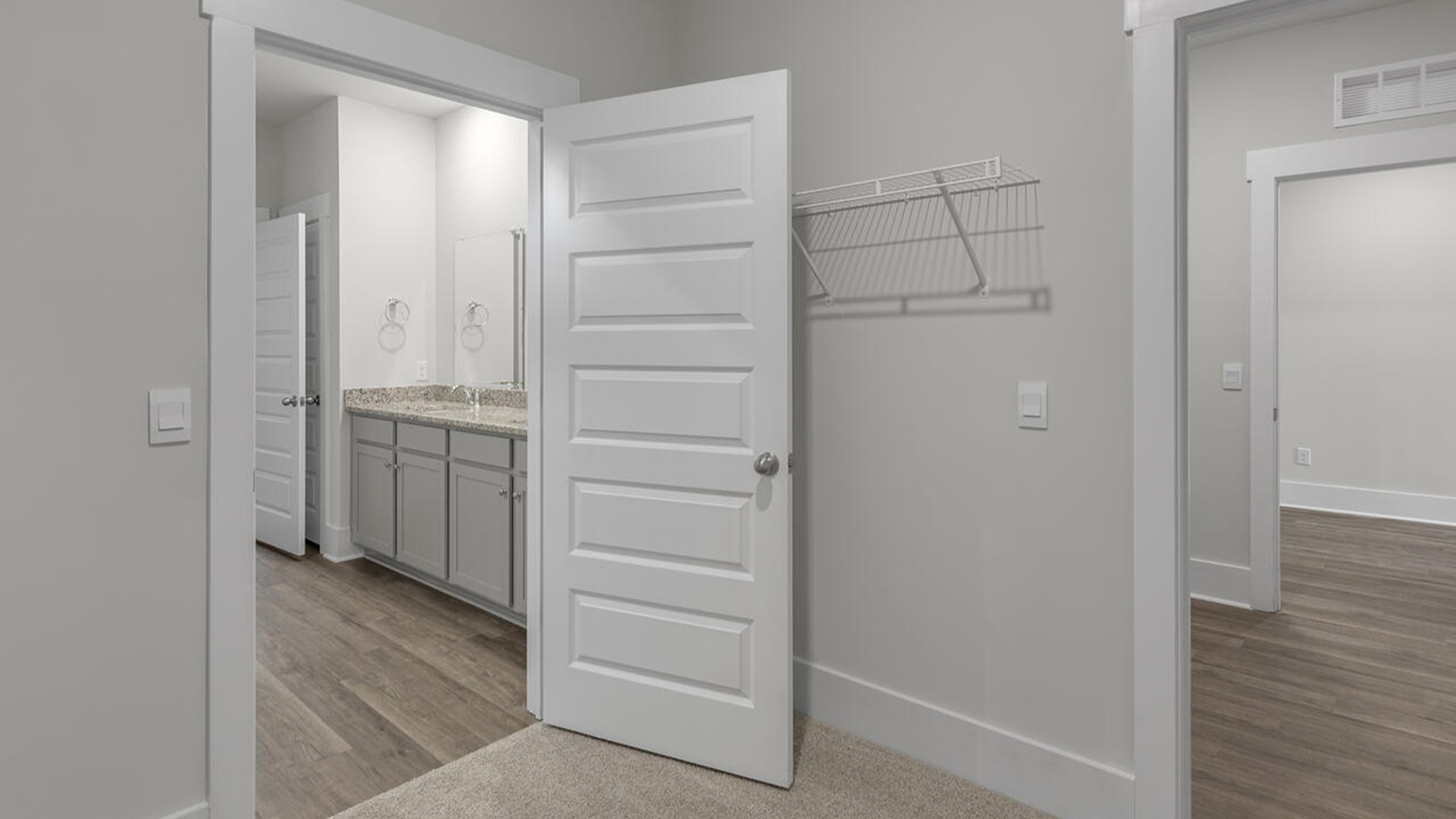 The primary bedroom has its own attached bathroom that features a walk-in closet and all the space you need to get ready in the morning.