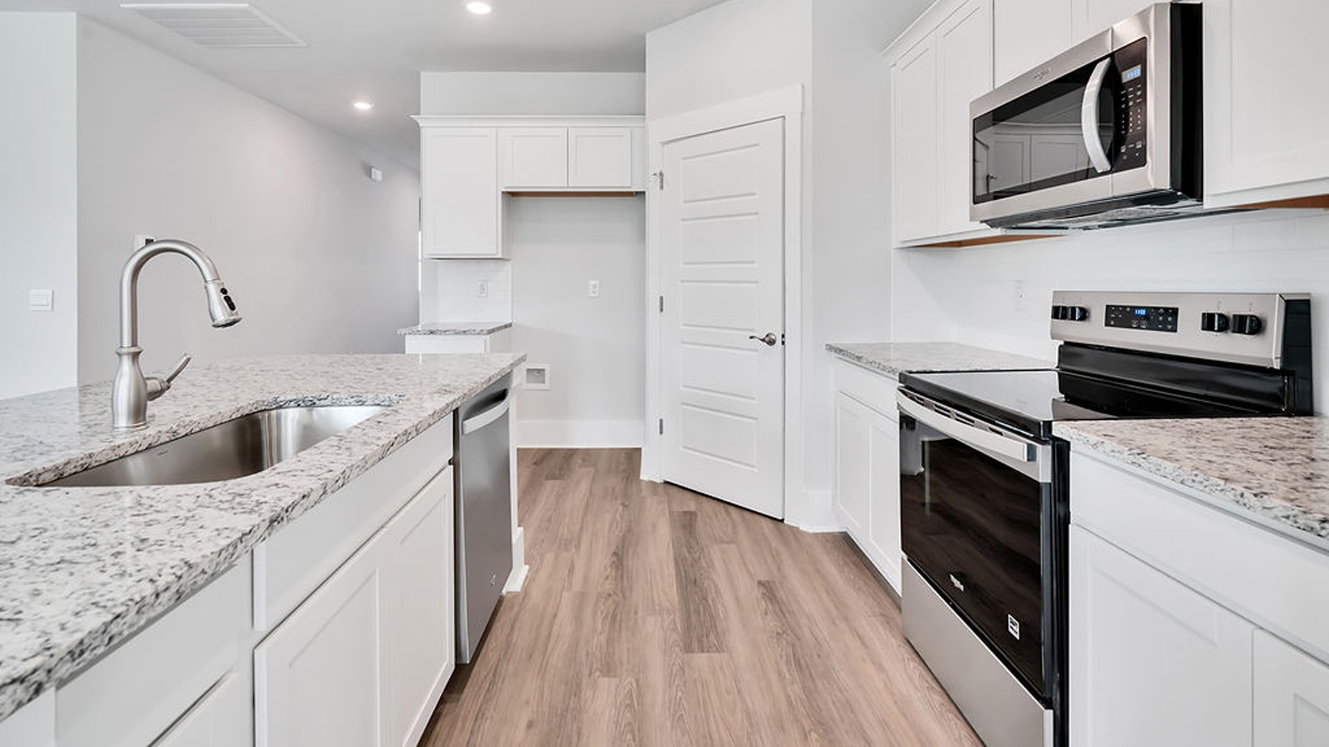 The kitchen comes finished with beautiful granite countertops, stainless steel appliances, single-bowl sink and tile backsplash. You'll never be too far from the action with the living and dining area right there.