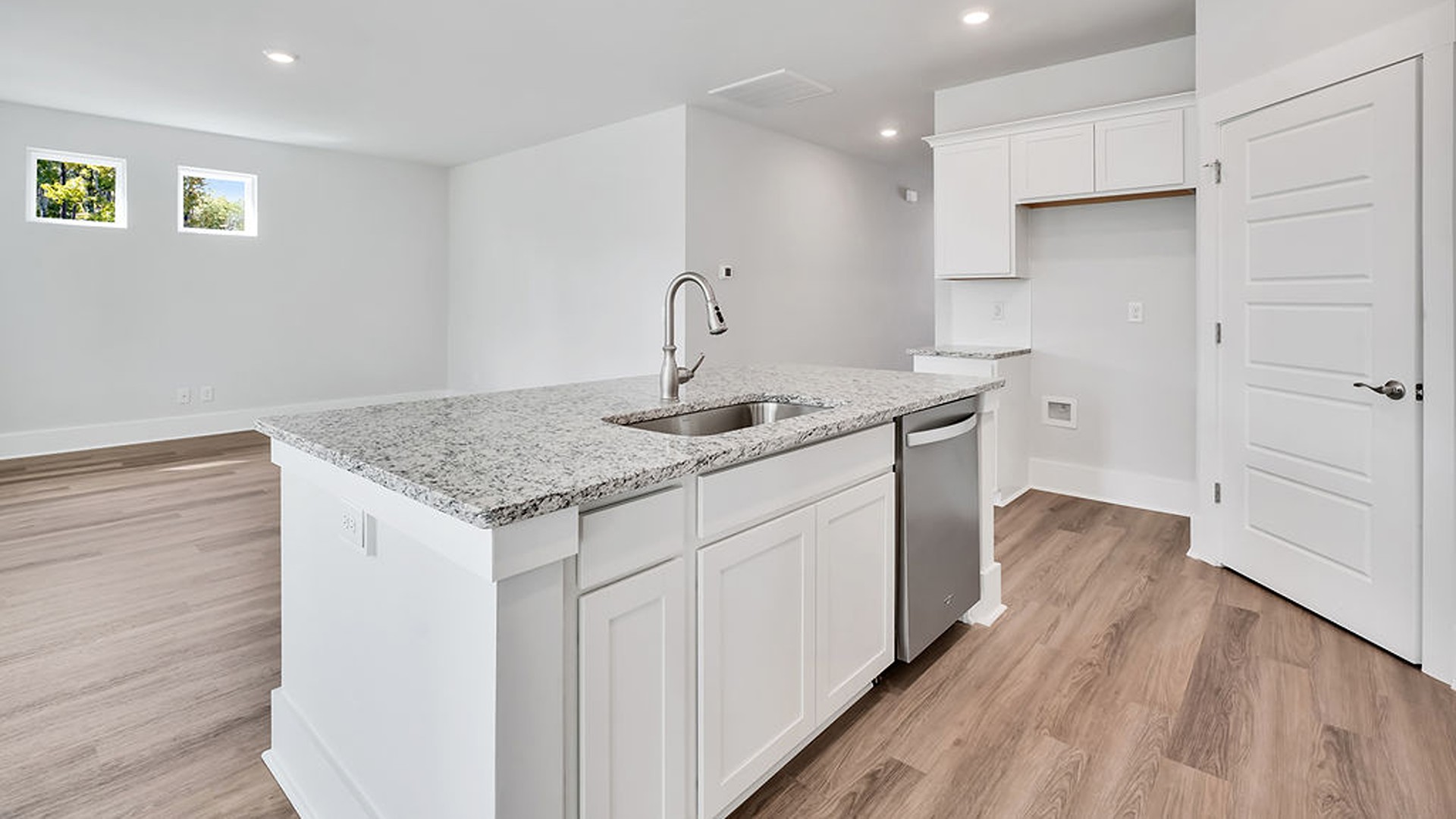 The kitchen comes finished with beautiful granite countertops, stainless steel appliances, single-bowl sink and tile backsplash. You'll never be too far from the action with the living and dining area right there.