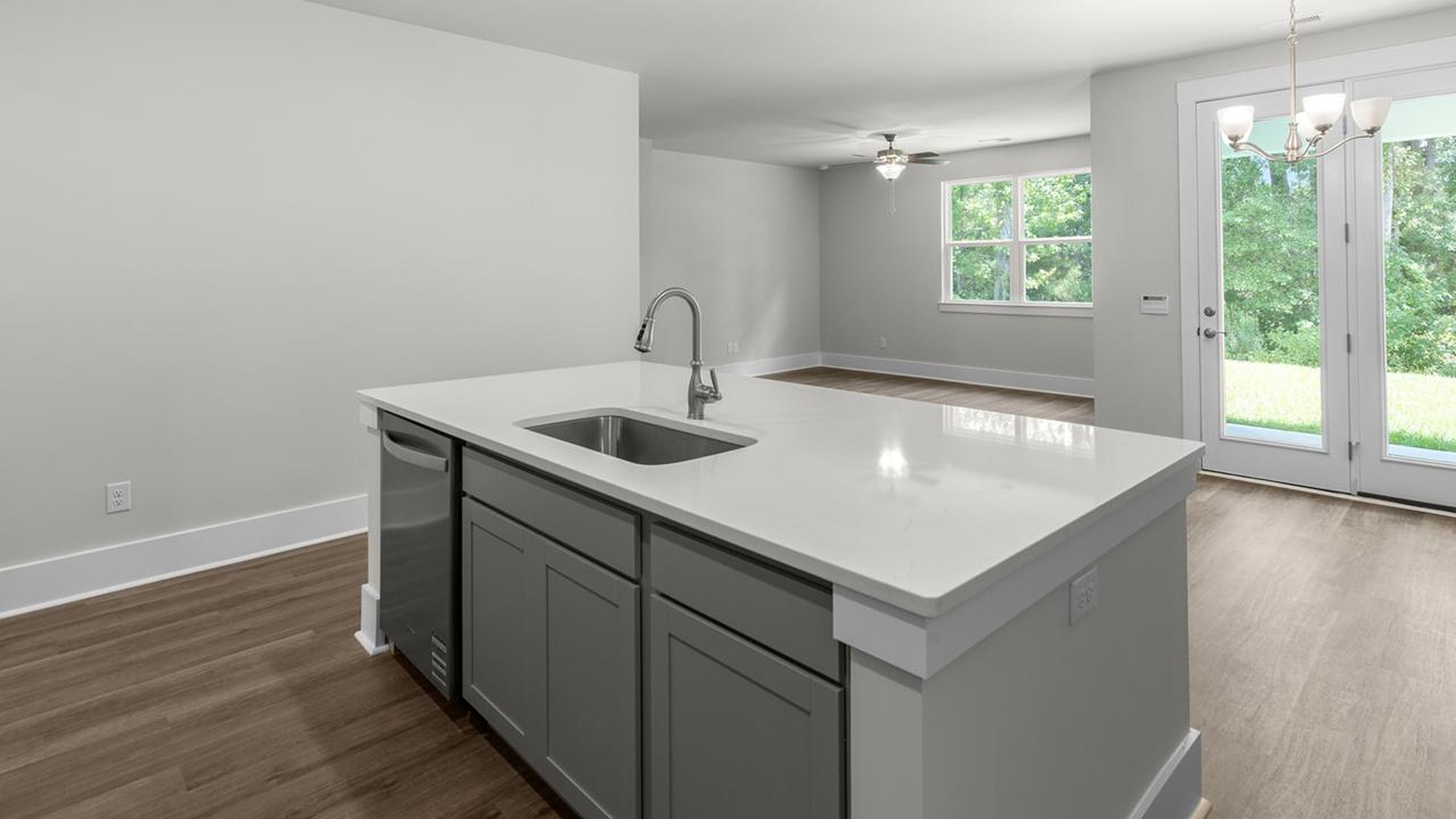 The well-appointed kitchen is equipped with modern appliances, walk-in pantry, and center island, perfect for both cooking and casual dining.