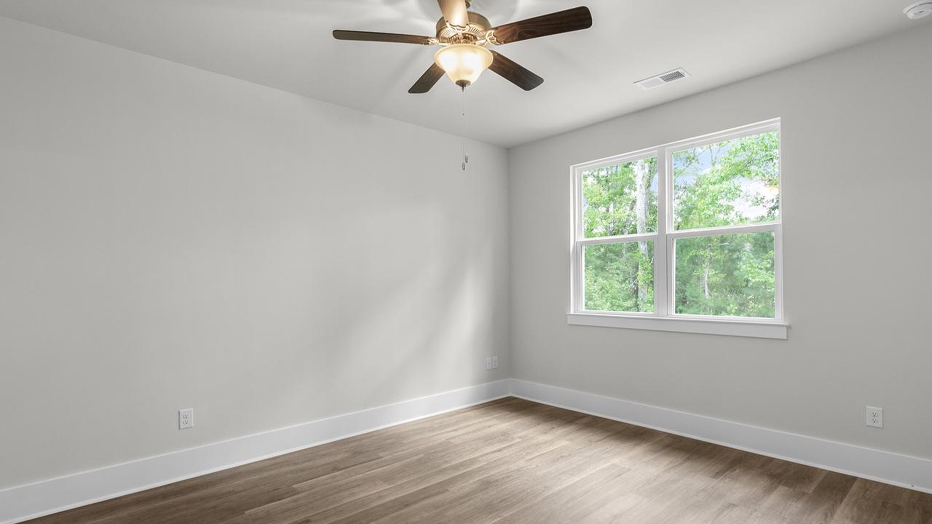 The primary suite serves as a peaceful retreat, featuring an en-suite bathroom with dual vanities and a walk-in closet. The additional bedrooms provide comfort and privacy and share access to a secondary bathroom.