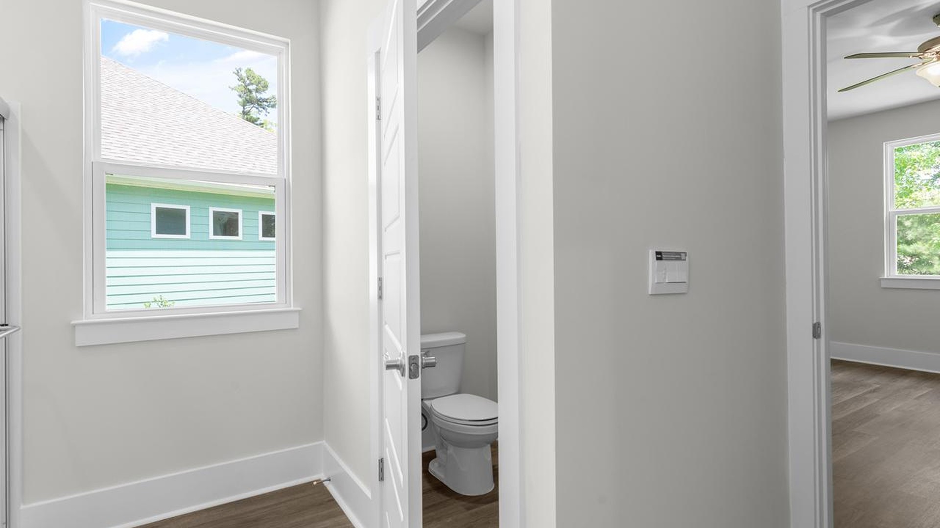 The primary suite serves as a peaceful retreat, featuring an en-suite bathroom with dual vanities and a walk-in closet. The additional bedrooms provide comfort and privacy and share access to a secondary bathroom.