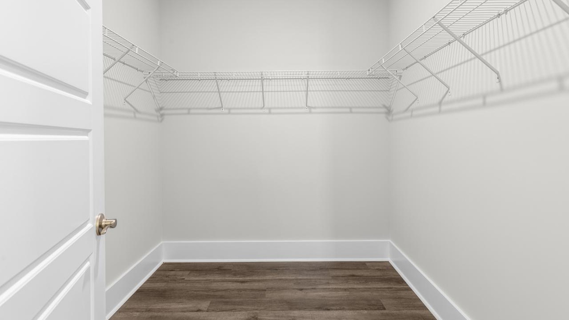 The primary suite serves as a peaceful retreat, featuring an en-suite bathroom with dual vanities and a walk-in closet. The additional bedrooms provide comfort and privacy and share access to a secondary bathroom.
