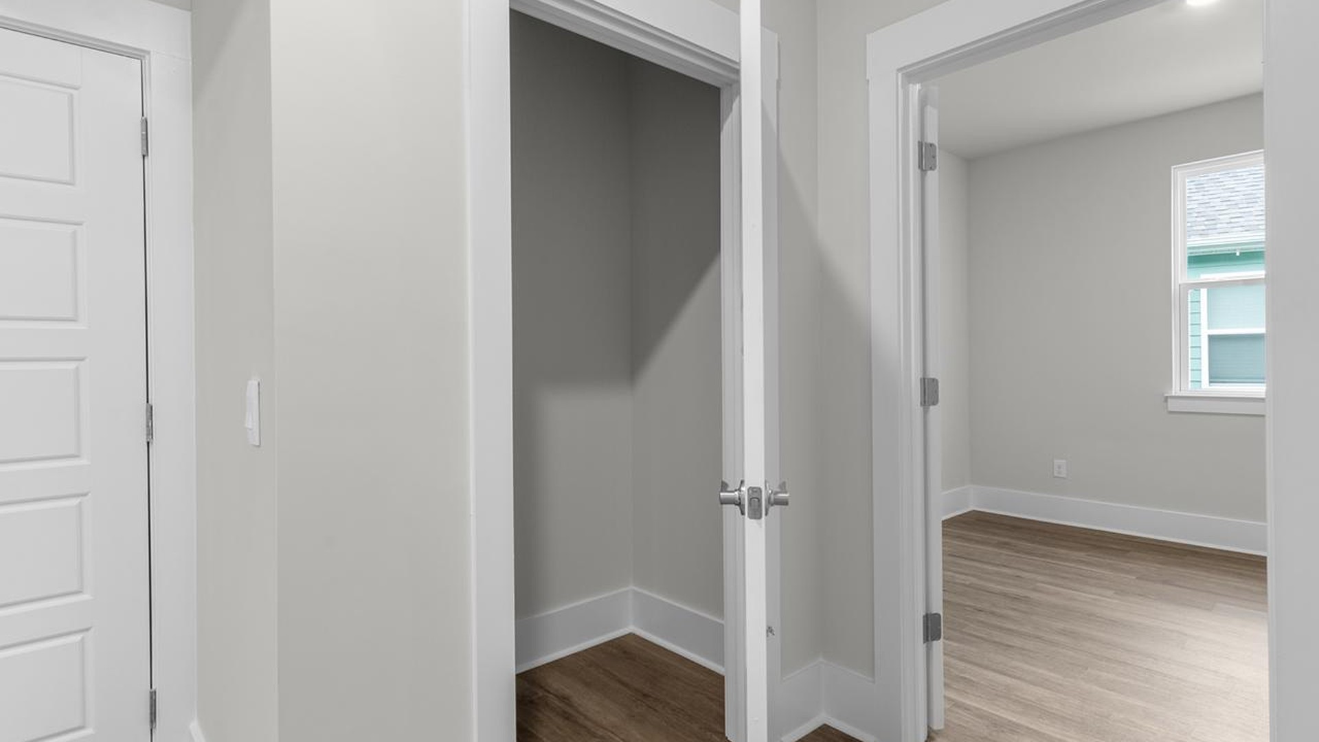 The primary suite serves as a peaceful retreat, featuring an en-suite bathroom with dual vanities and a walk-in closet. The additional bedrooms provide comfort and privacy and share access to a secondary bathroom.