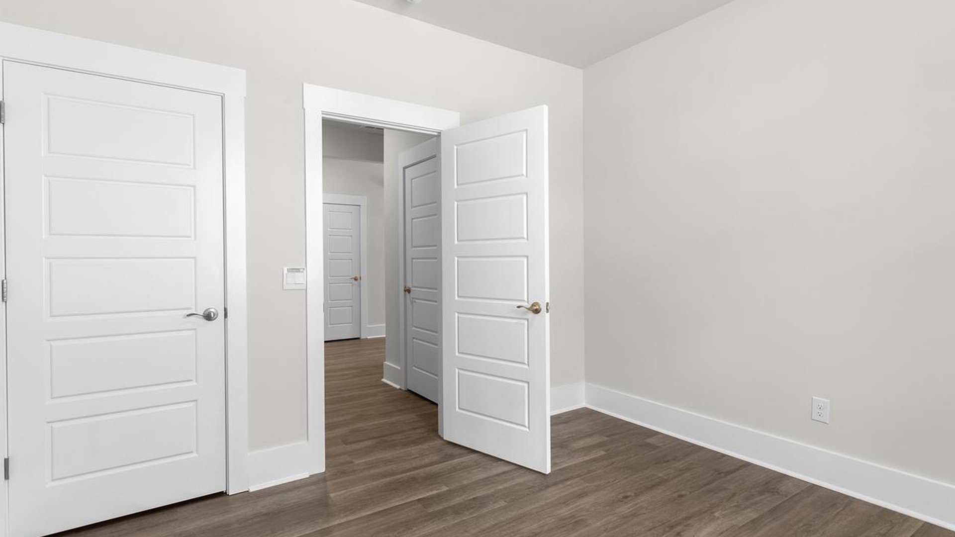 The primary suite serves as a peaceful retreat, featuring an en-suite bathroom with dual vanities and a walk-in closet. The additional bedrooms provide comfort and privacy and share access to a secondary bathroom.