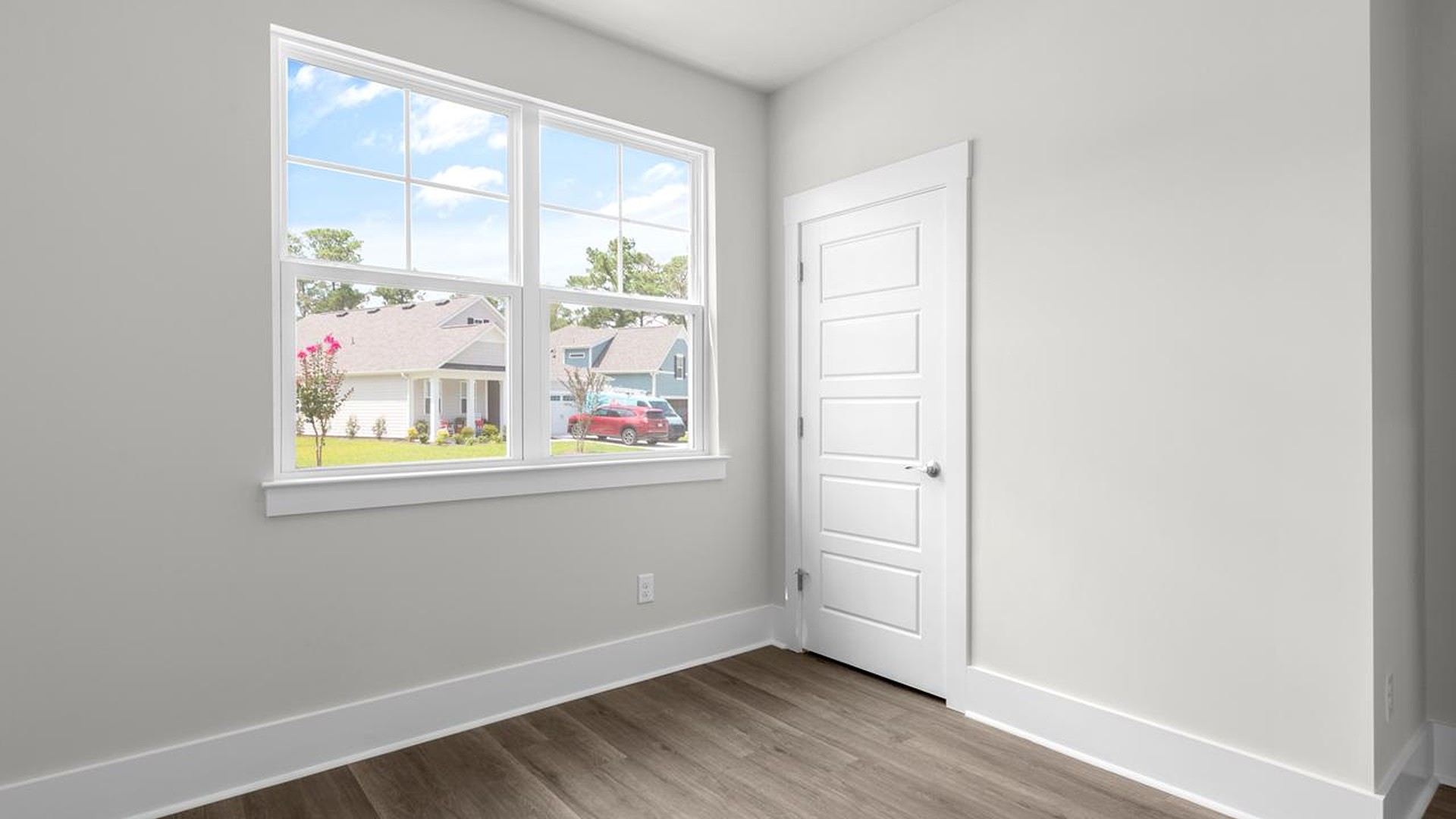 The primary suite serves as a peaceful retreat, featuring an en-suite bathroom with dual vanities and a walk-in closet. The additional bedrooms provide comfort and privacy and share access to a secondary bathroom.