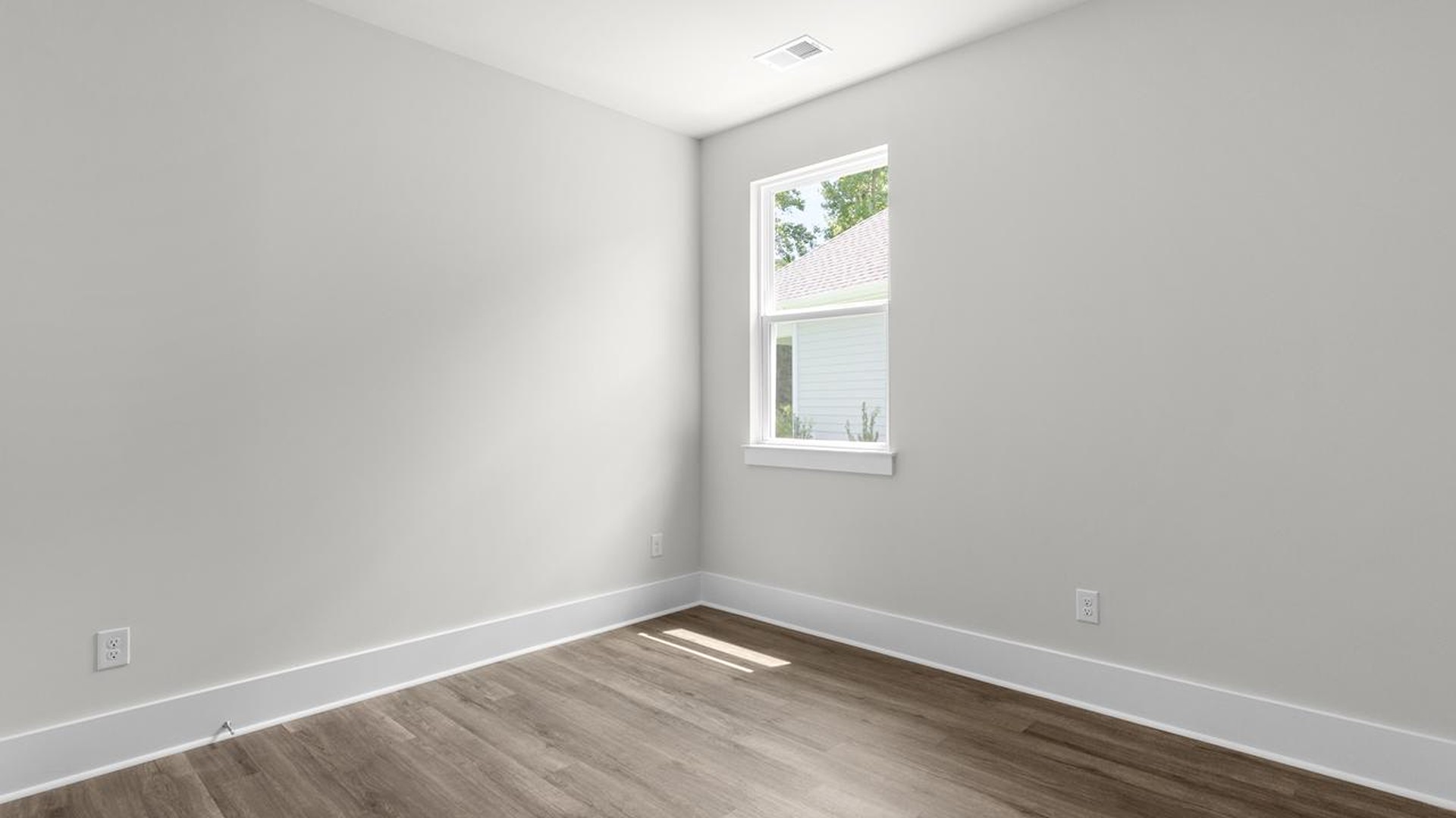 The primary suite serves as a peaceful retreat, featuring an en-suite bathroom with dual vanities and a walk-in closet. The additional bedrooms provide comfort and privacy and share access to a secondary bathroom.