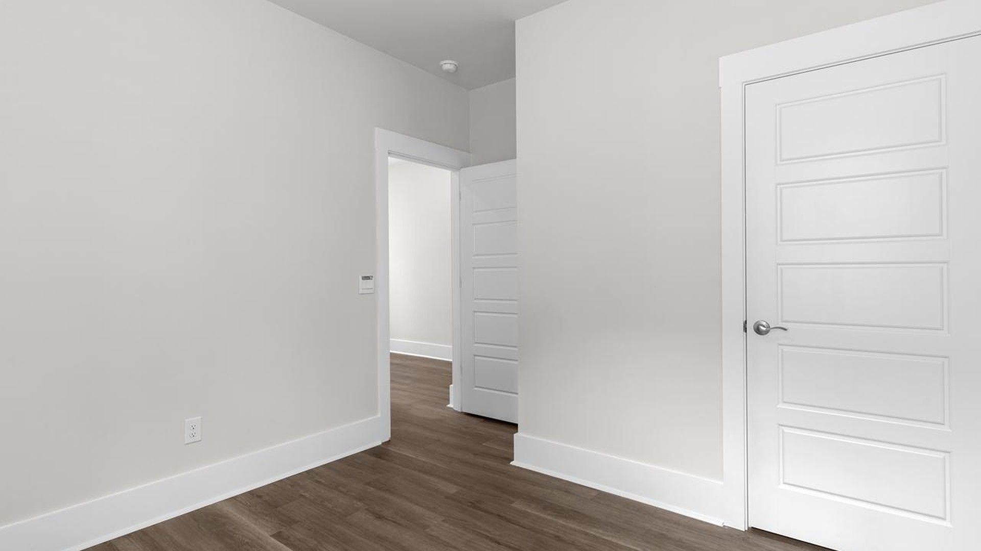 The primary suite serves as a peaceful retreat, featuring an en-suite bathroom with dual vanities and a walk-in closet. The additional bedrooms provide comfort and privacy and share access to a secondary bathroom.