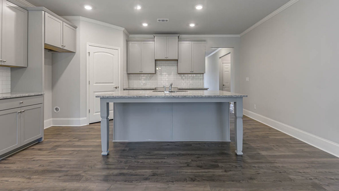 Upon entering you will be greeted by a grand entryway that sets the tone for the rest of the home. The well-appointed kitchen is equipped with modern appliances, walk-in pantry, and center island, perfect for both cooking and casual dining.