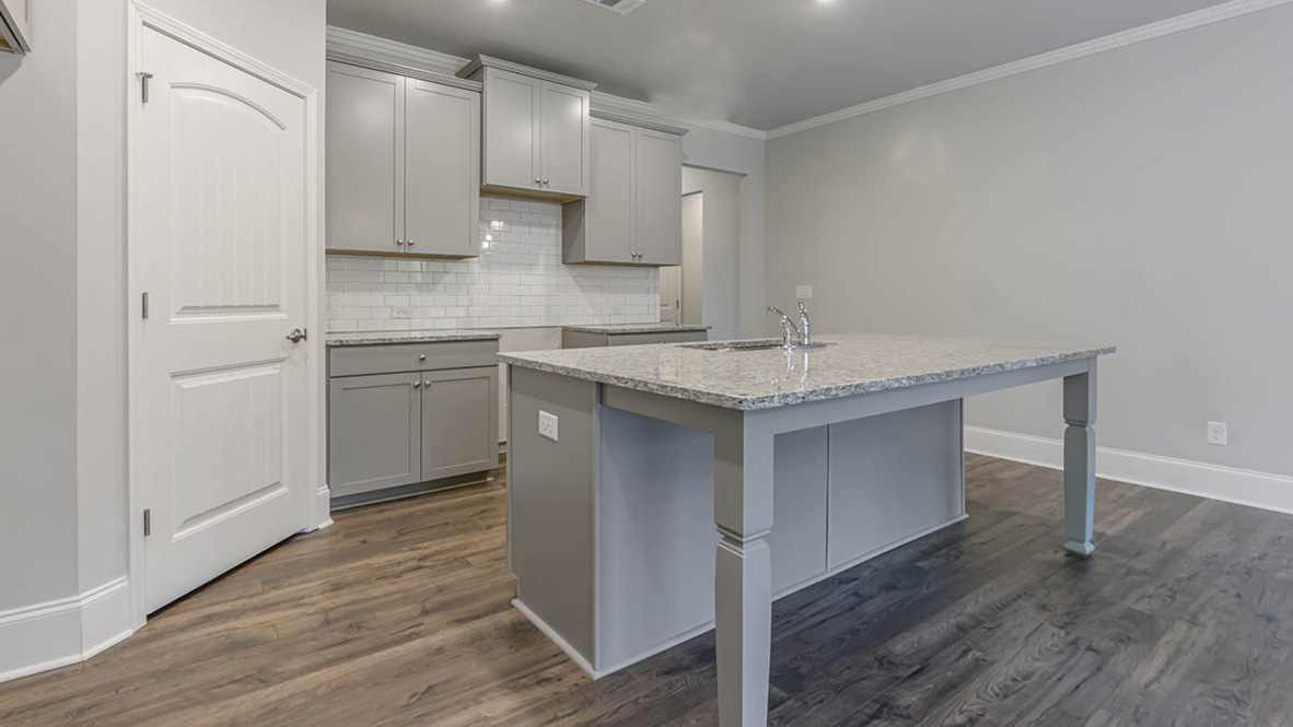 Upon entering you will be greeted by a grand entryway that sets the tone for the rest of the home. The well-appointed kitchen is equipped with modern appliances, walk-in pantry, and center island, perfect for both cooking and casual dining.