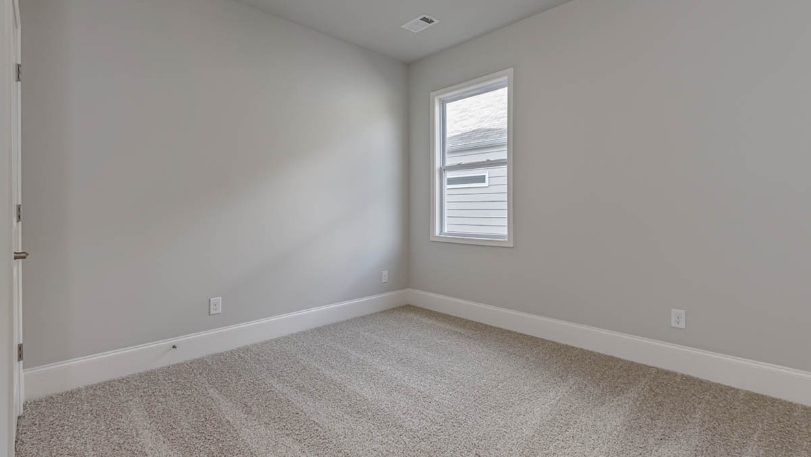 The additional bedrooms provide comfort and privacy and share access to a secondary bathroom.