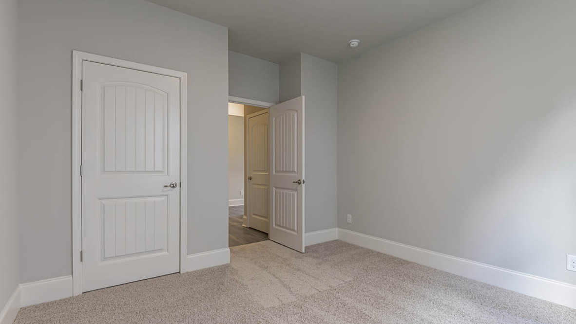 The additional bedrooms provide comfort and privacy and share access to a secondary bathroom.