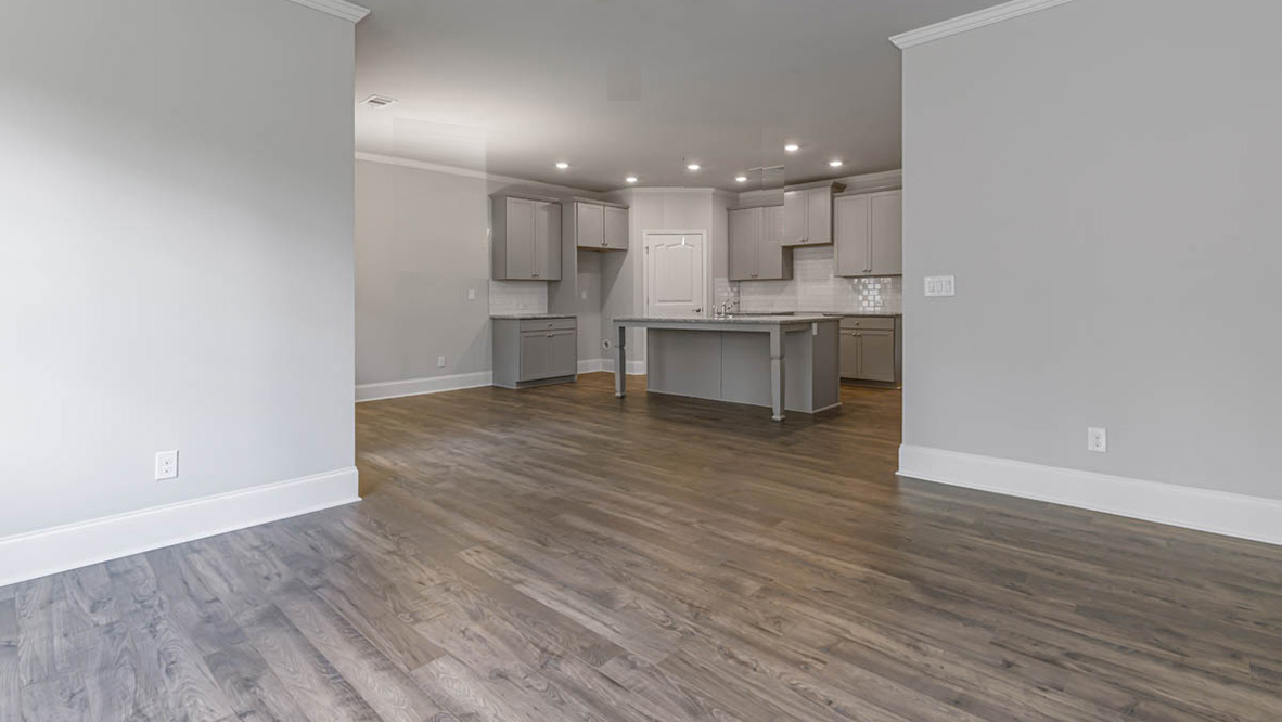 The primary suite serves as a peaceful retreat, featuring an en-suite bathroom with dual vanities and a walk-in closet.