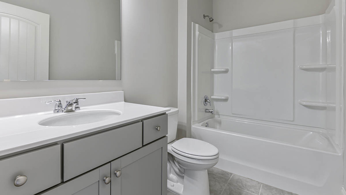 The additional bedrooms provide comfort and privacy and share access to a secondary bathroom.