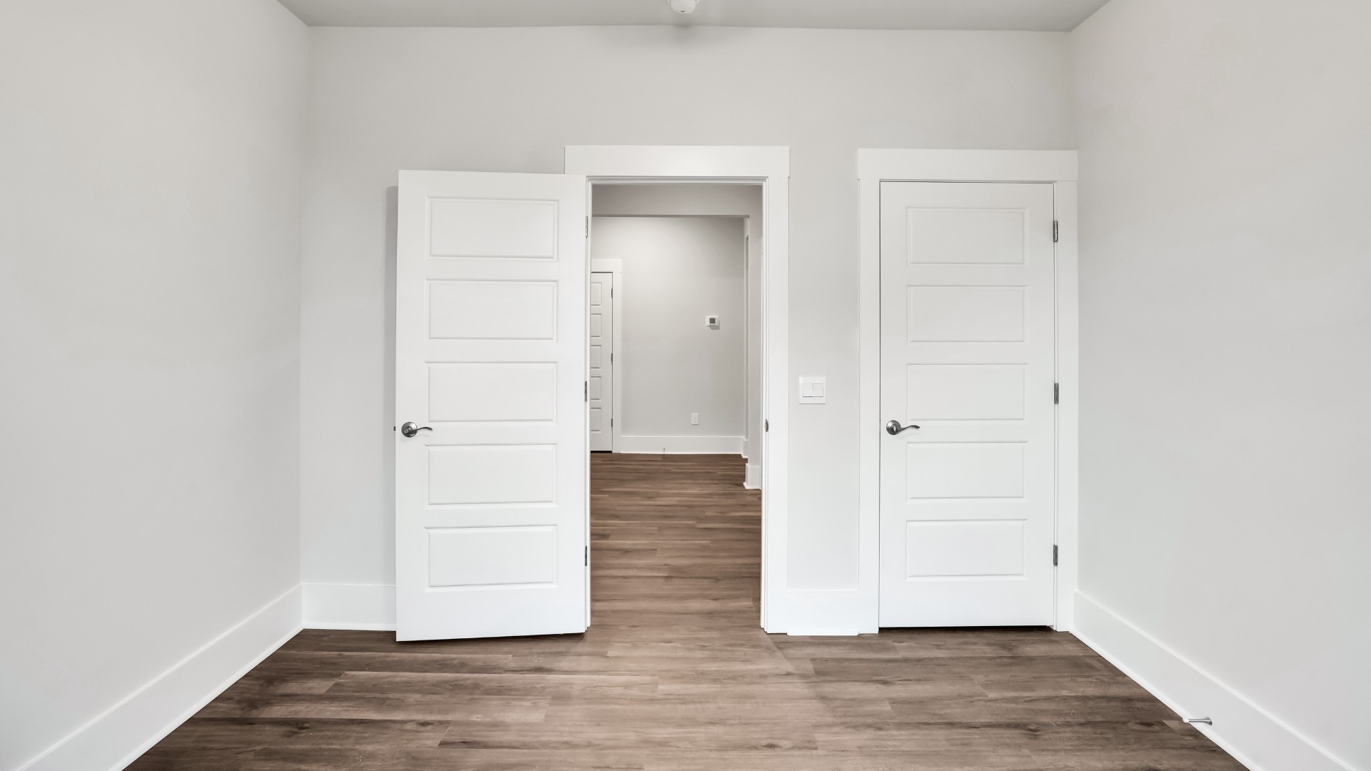 The primary suite serves as a peaceful retreat, featuring an en-suite bathroom with dual vanities and a walk-in closet.
