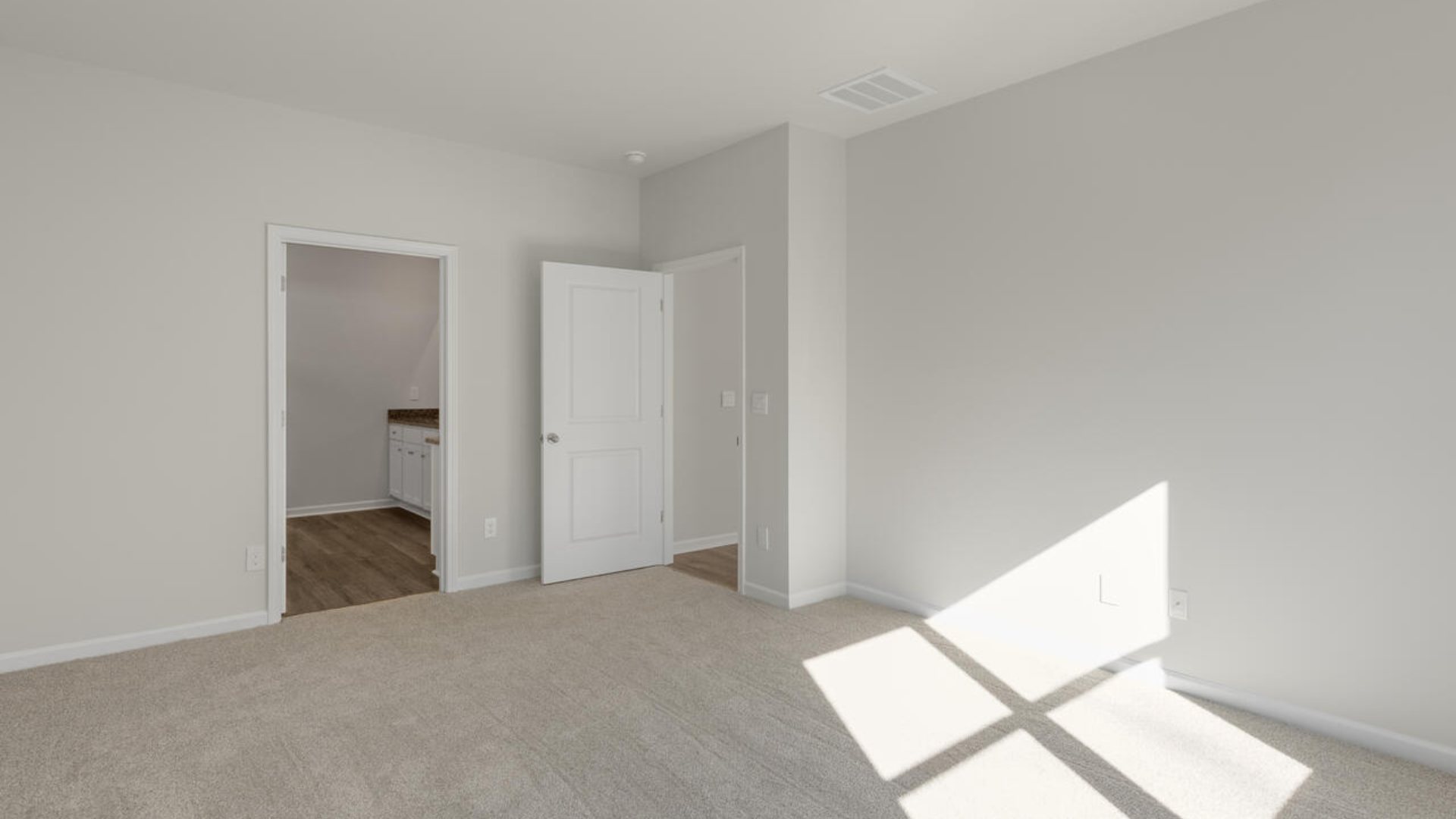 The primary suite as well as on suite is sure to impress with double vanities and a massive walk-in closet., a large, covered porch for those nice breezy sunsets! LVP floors are installed throughout the home as well as the stain resistant carpets that add comfort to the bedrooms.