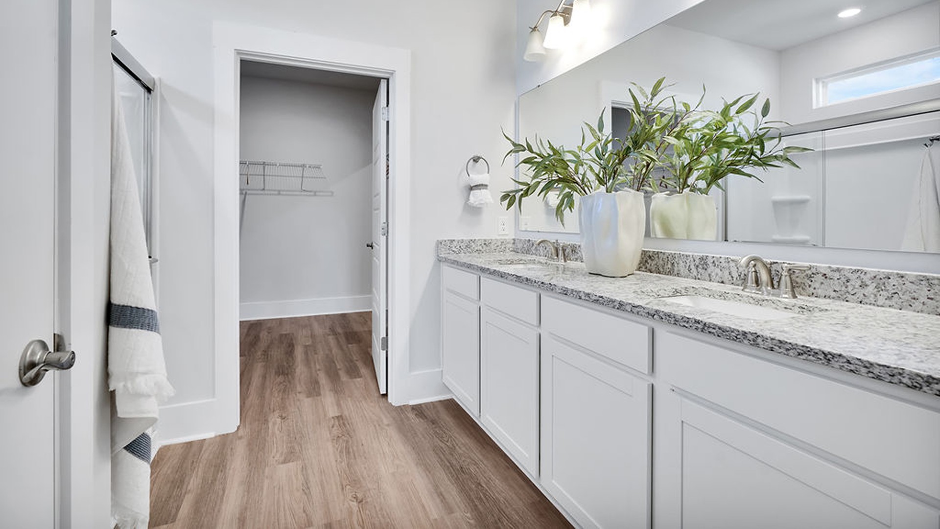 The primary bedroom has its own attached bathroom that features a walk-in closet and all the space you need to get ready in the morning. Sharing a sink isn’t a worry with the double vanity, and you also get additional privacy with a separate door for the toilet and shower.