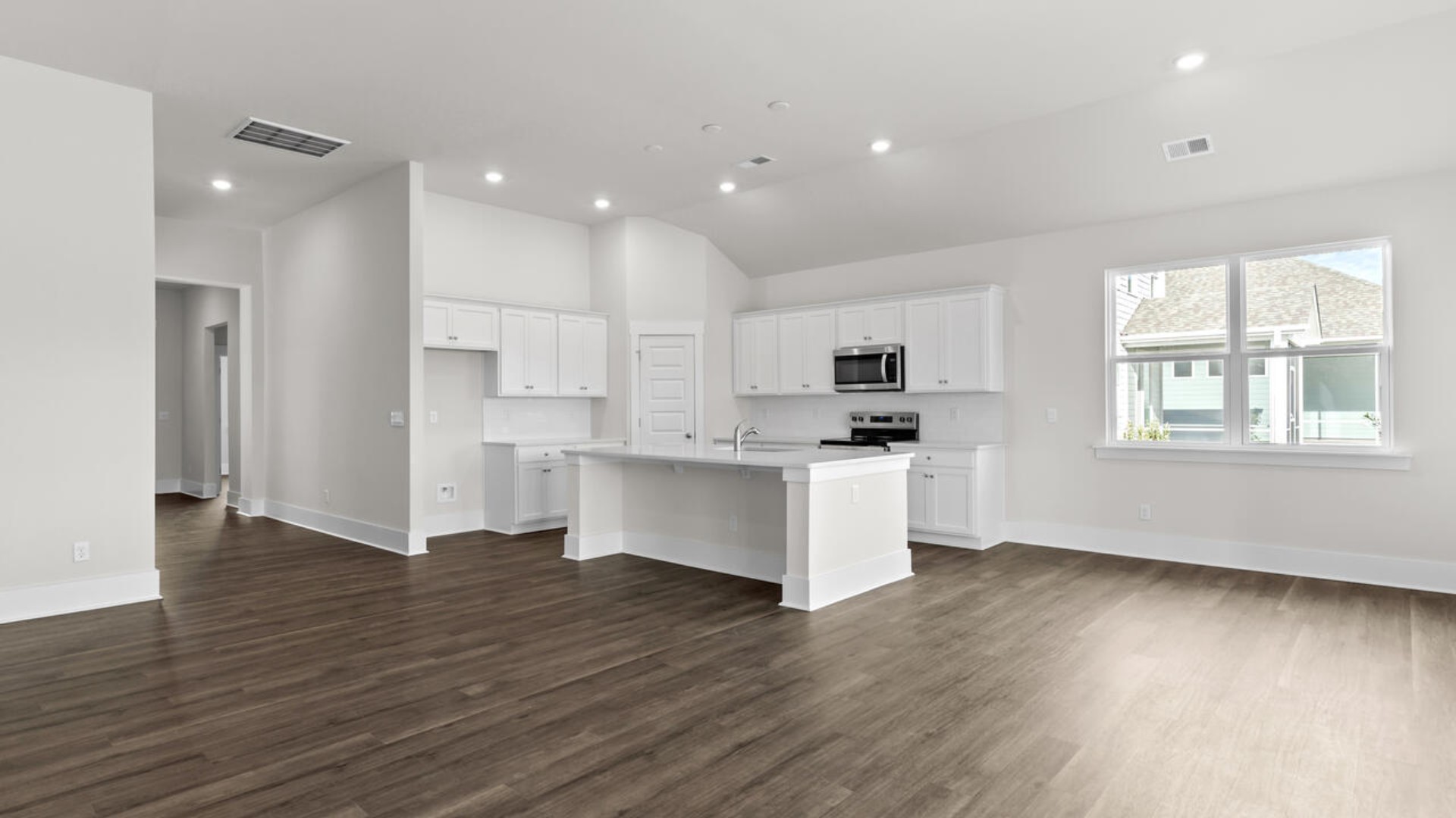 High ceilings and lots of windows create a bright and airy entertaining space. Open concept design with plenty of room for everyone to gather around the huge kitchen island.