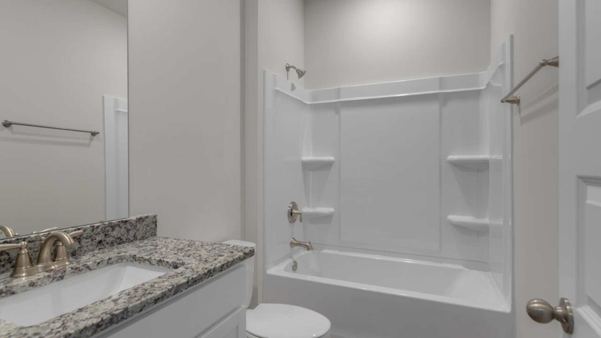 There are three bedrooms at the front of the home with a full bathroom as well as laundry room.