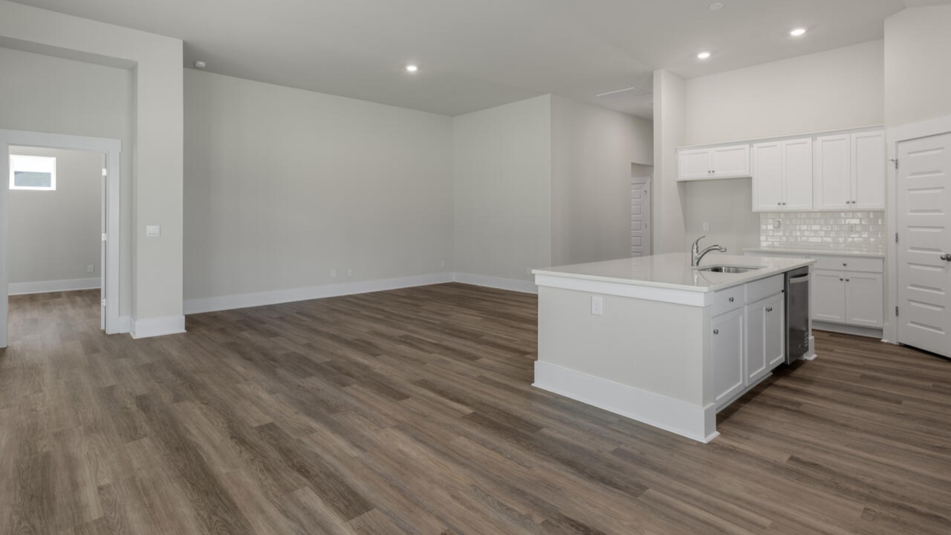 vOpen concept design with plenty of room for everyone to gather around the huge kitchen island.