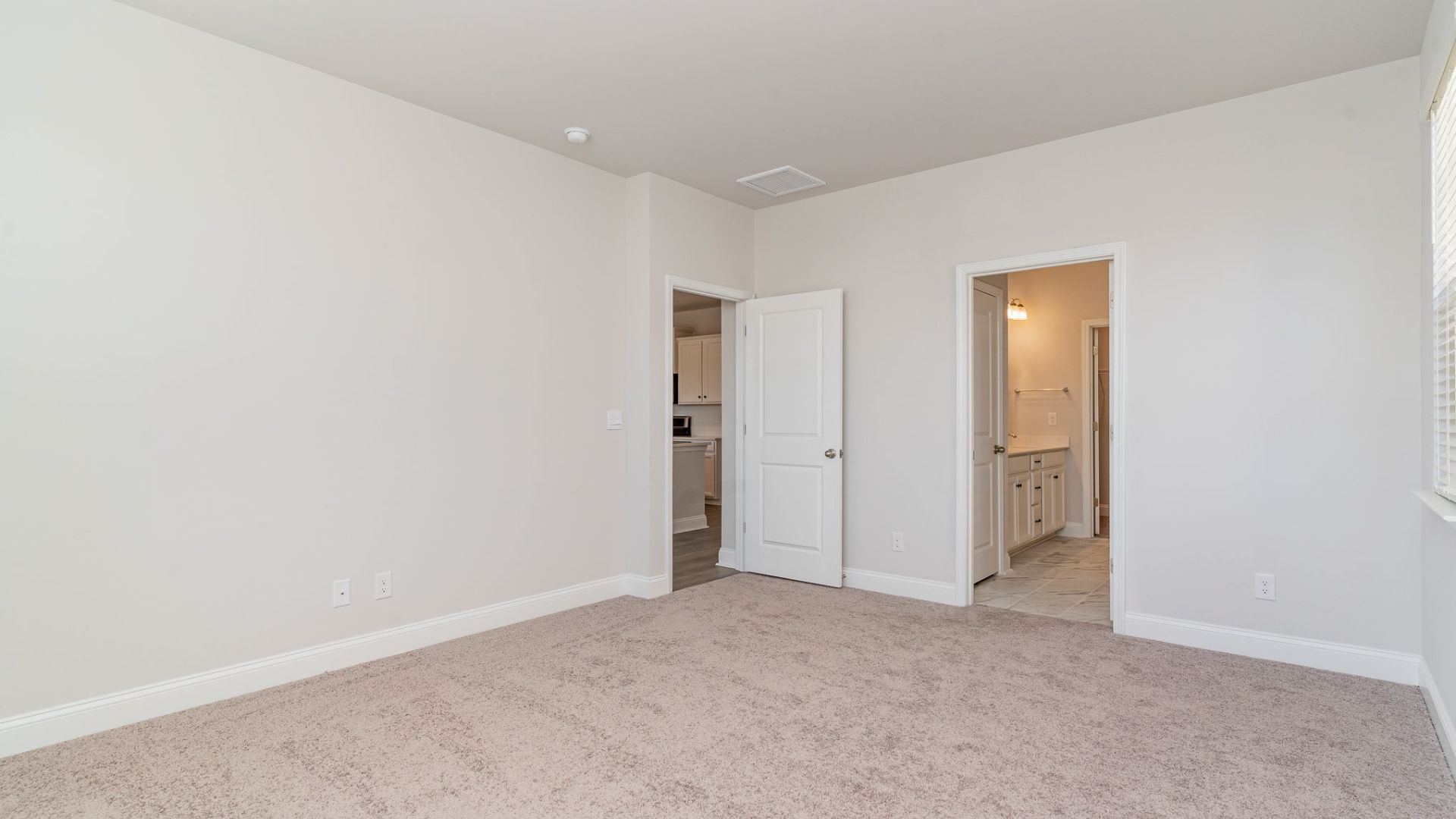 The primary bedroom has its own attached bathroom that features a walk-in closet and all the space you need to get ready in the morning.