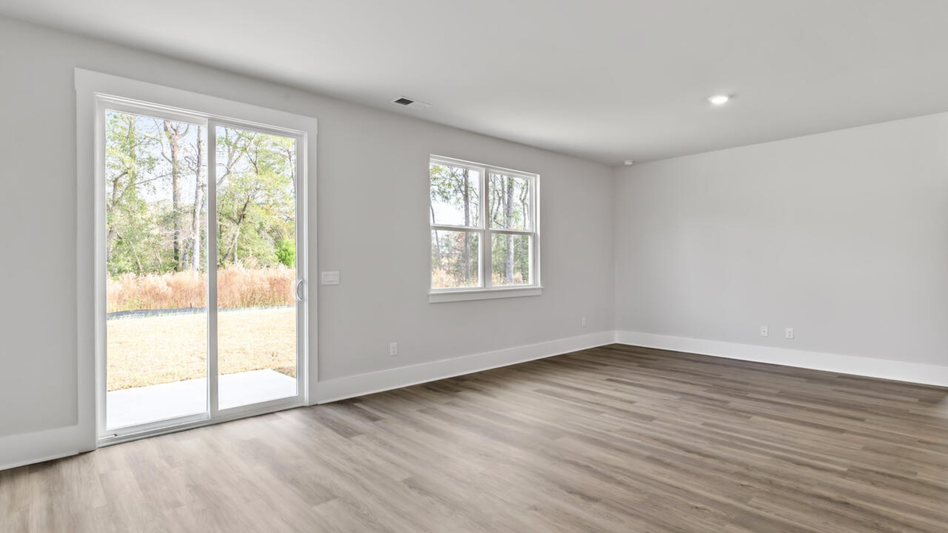 This home features a first floor primary bedroom suite and laundry room. The open concept kitchen and great room are ideal for entertaining and creating lasting memories.