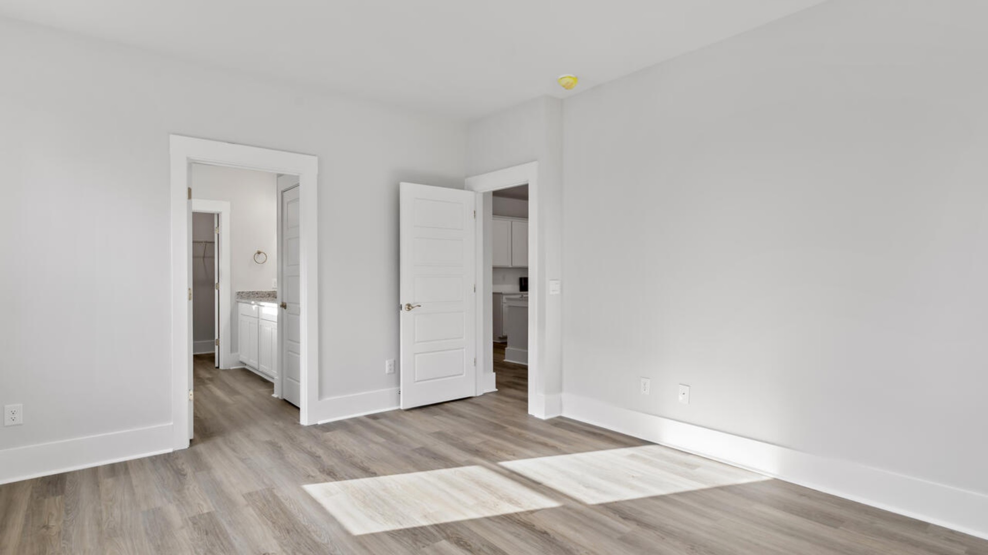 The primary bedroom has its own attached bathroom that features a walk-in closet and all the space you need to get ready in the morning.