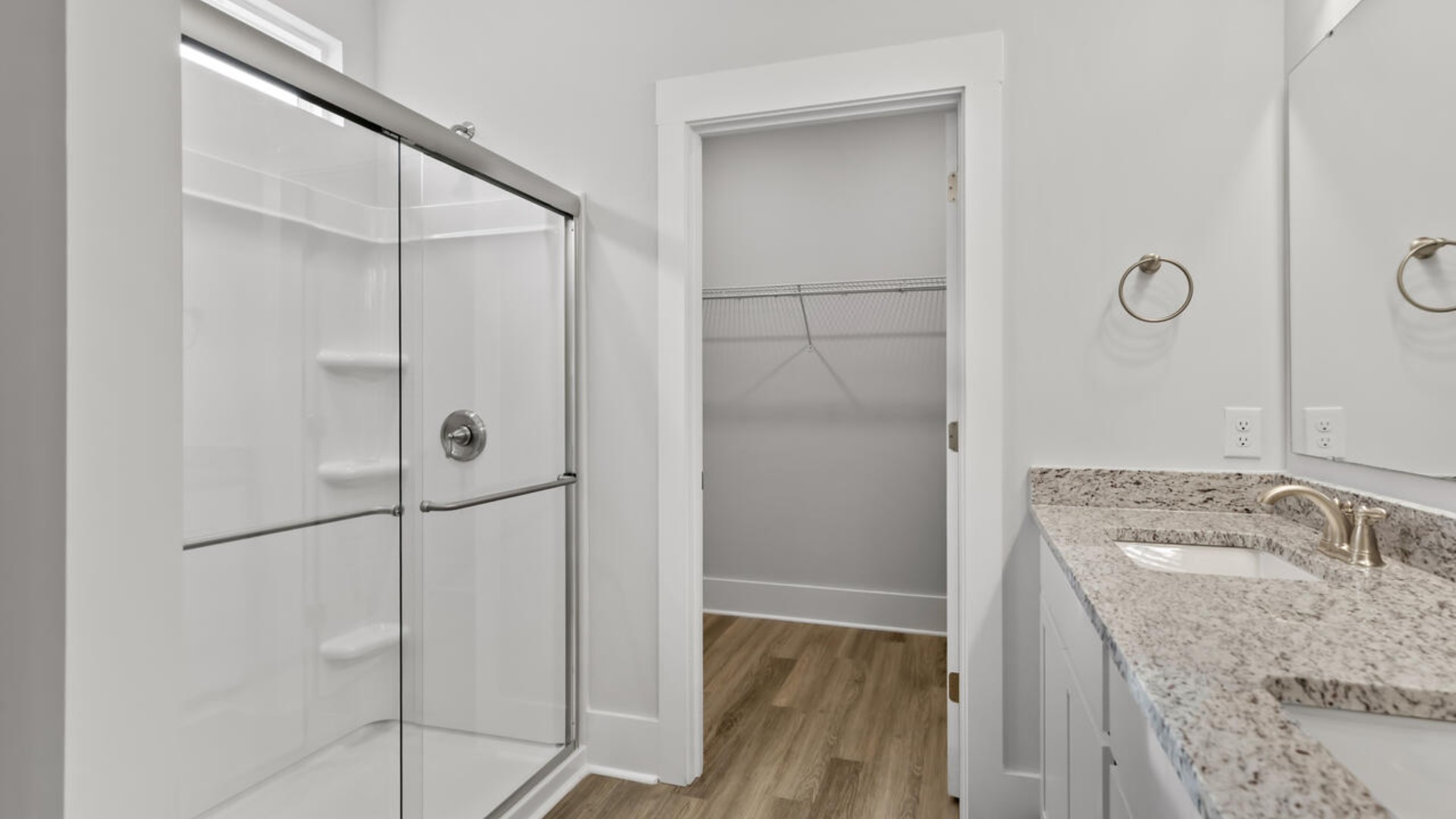 The primary bedroom has its own attached bathroom that features a walk-in closet and all the space you need to get ready in the morning.