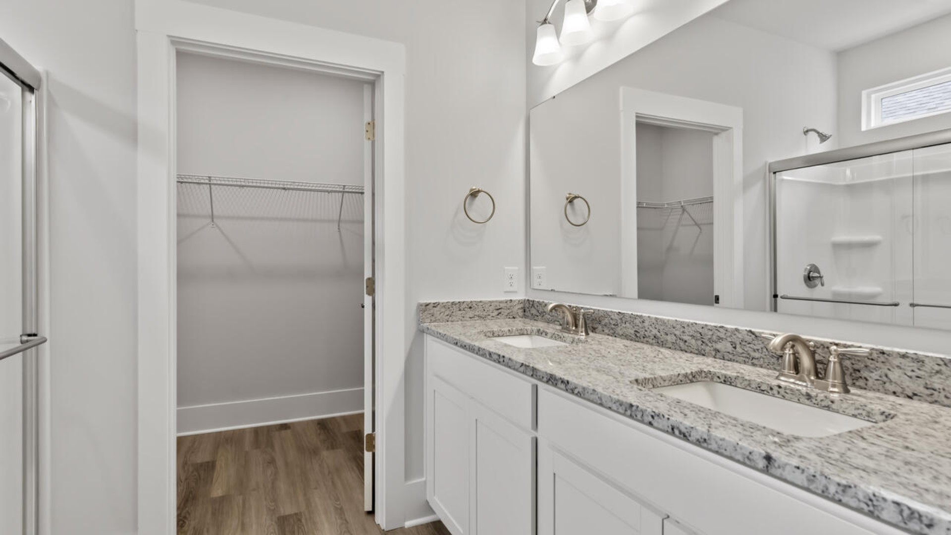 The primary bedroom has its own attached bathroom that features a walk-in closet and all the space you need to get ready in the morning.