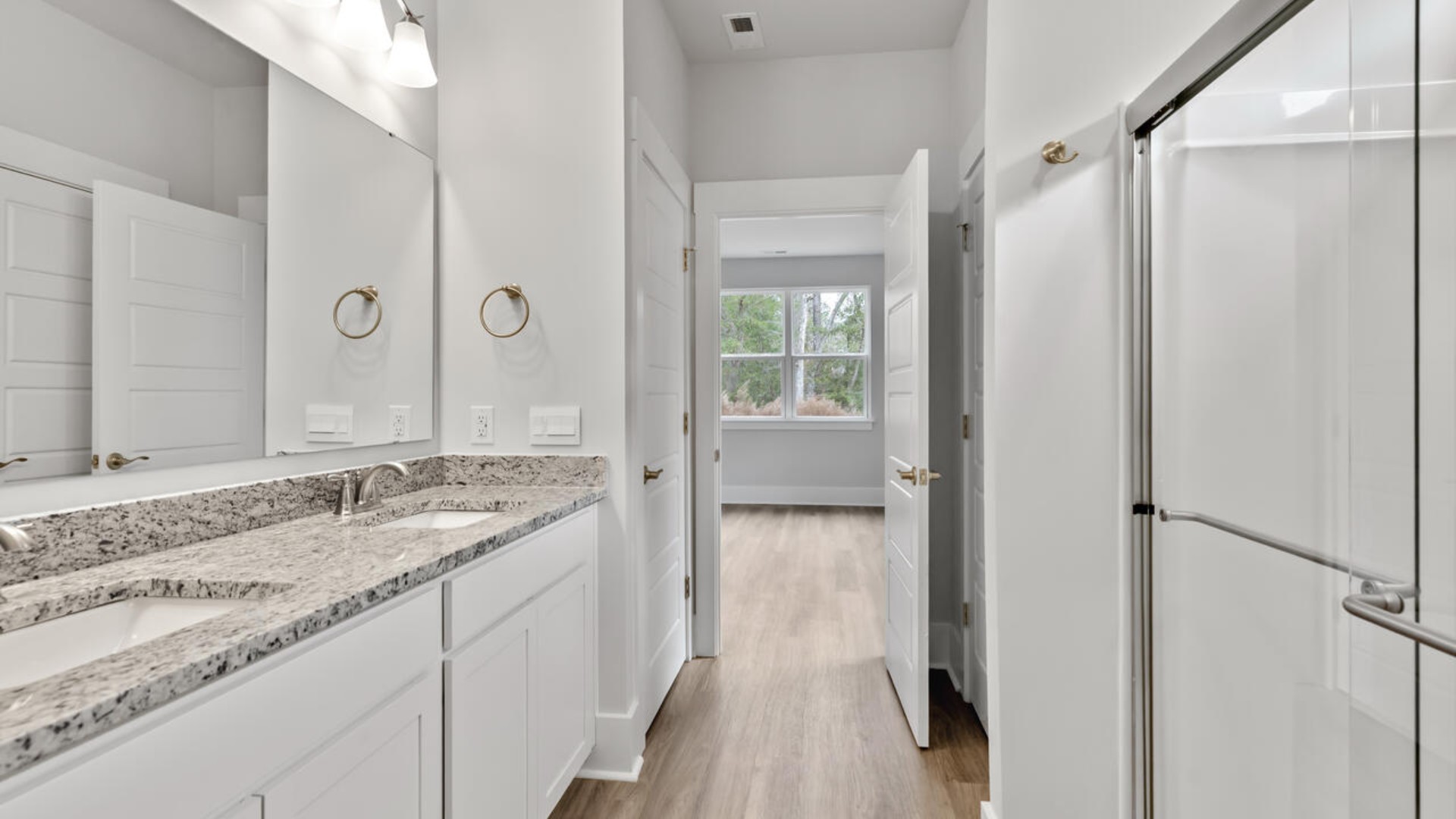 The primary bedroom has its own attached bathroom that features a walk-in closet and all the space you need to get ready in the morning.