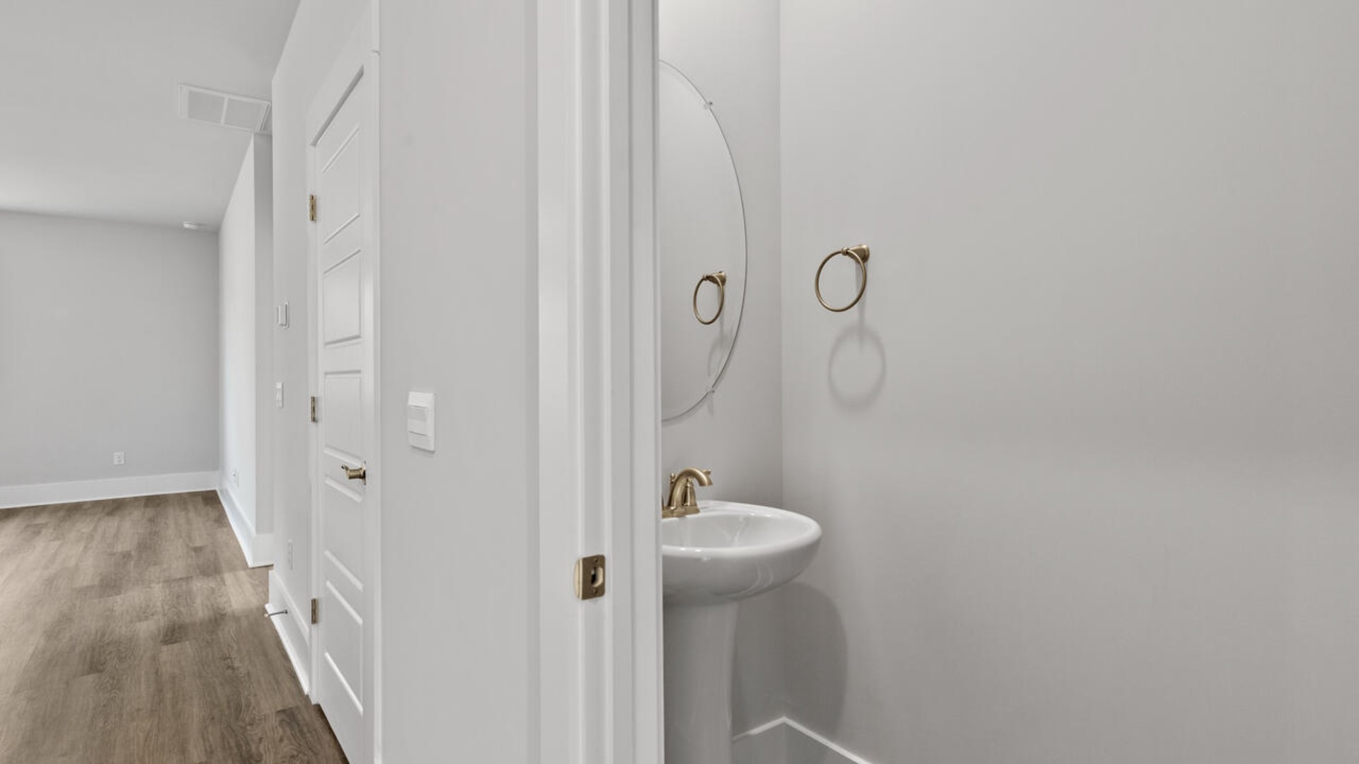 This home features a first-floor primary bedroom suite and laundry room. The open concept kitchen and great room are ideal for entertaining and creating lasting memories.