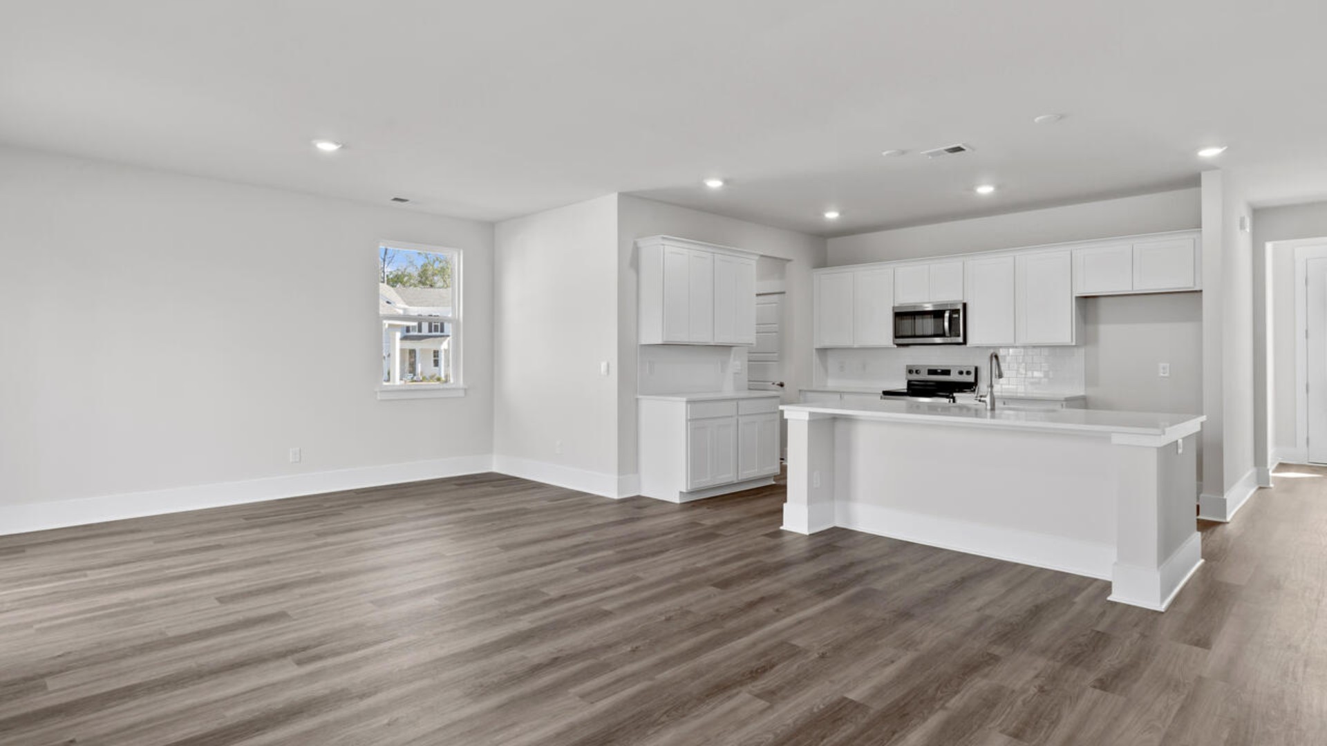 This home features a first floor primary bedroom suite and laundry room. The open concept kitchen and great room are ideal for entertaining and creating lasting memories.