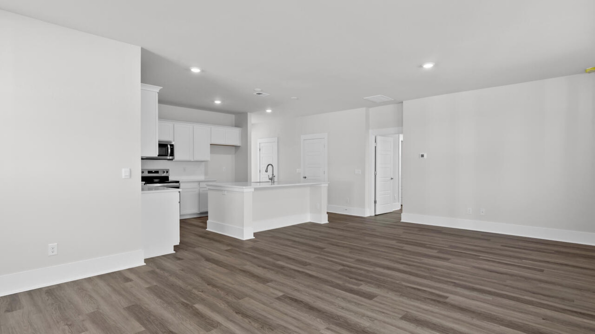 This home features a first floor primary bedroom suite and laundry room. The open concept kitchen and great room are ideal for entertaining and creating lasting memories.
