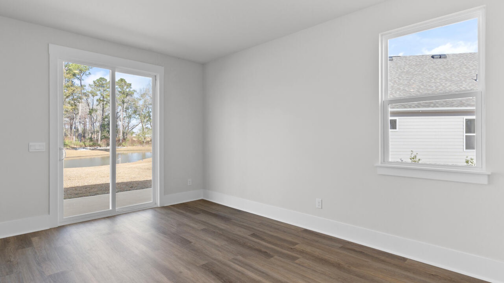 This home features a first floor primary bedroom suite and laundry room. The open concept kitchen and great room are ideal for entertaining and creating lasting memories.
