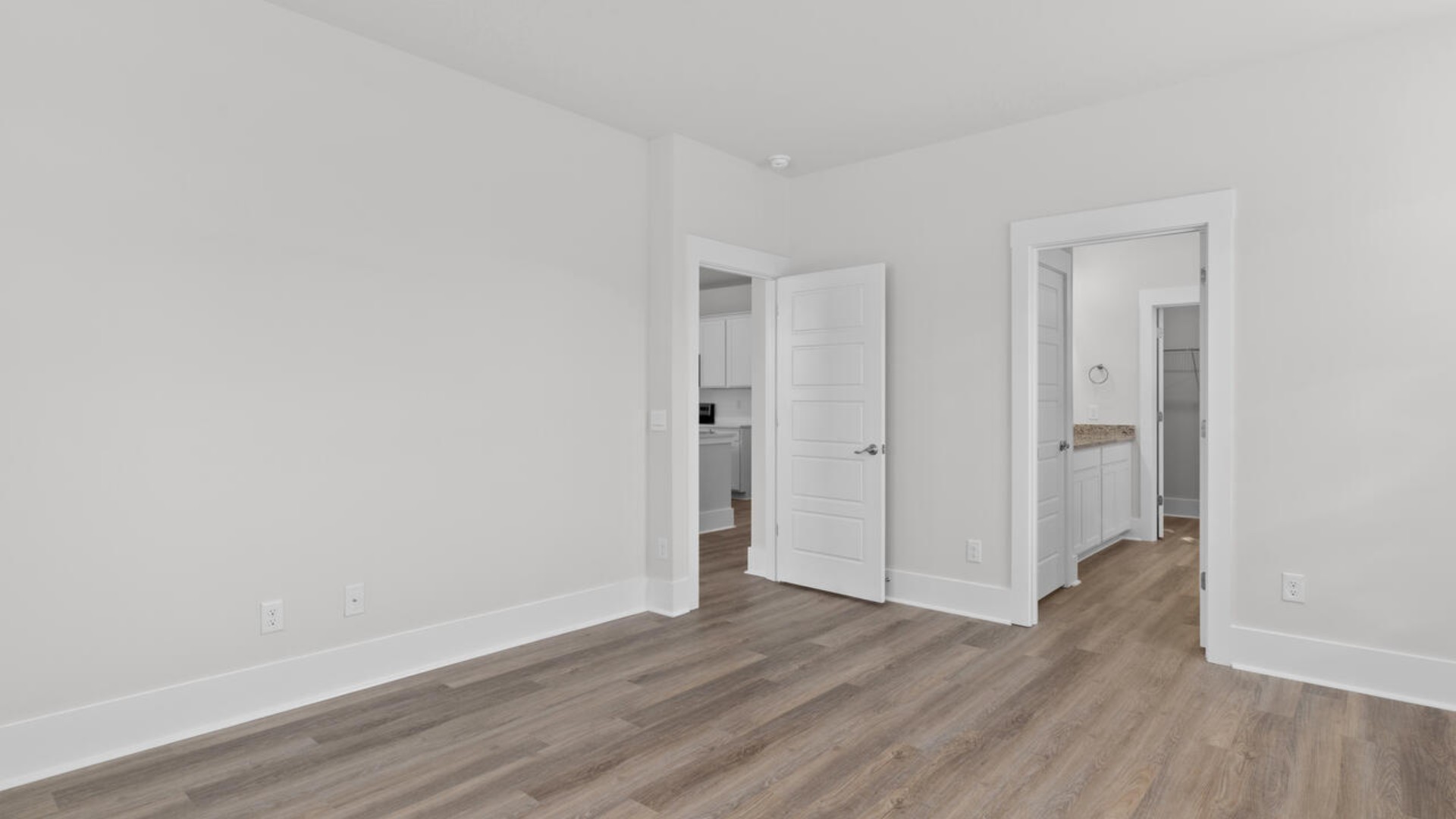 The primary bedroom has its own attached bathroom that features a walk-in closet and all the space you need to get ready in the morning.