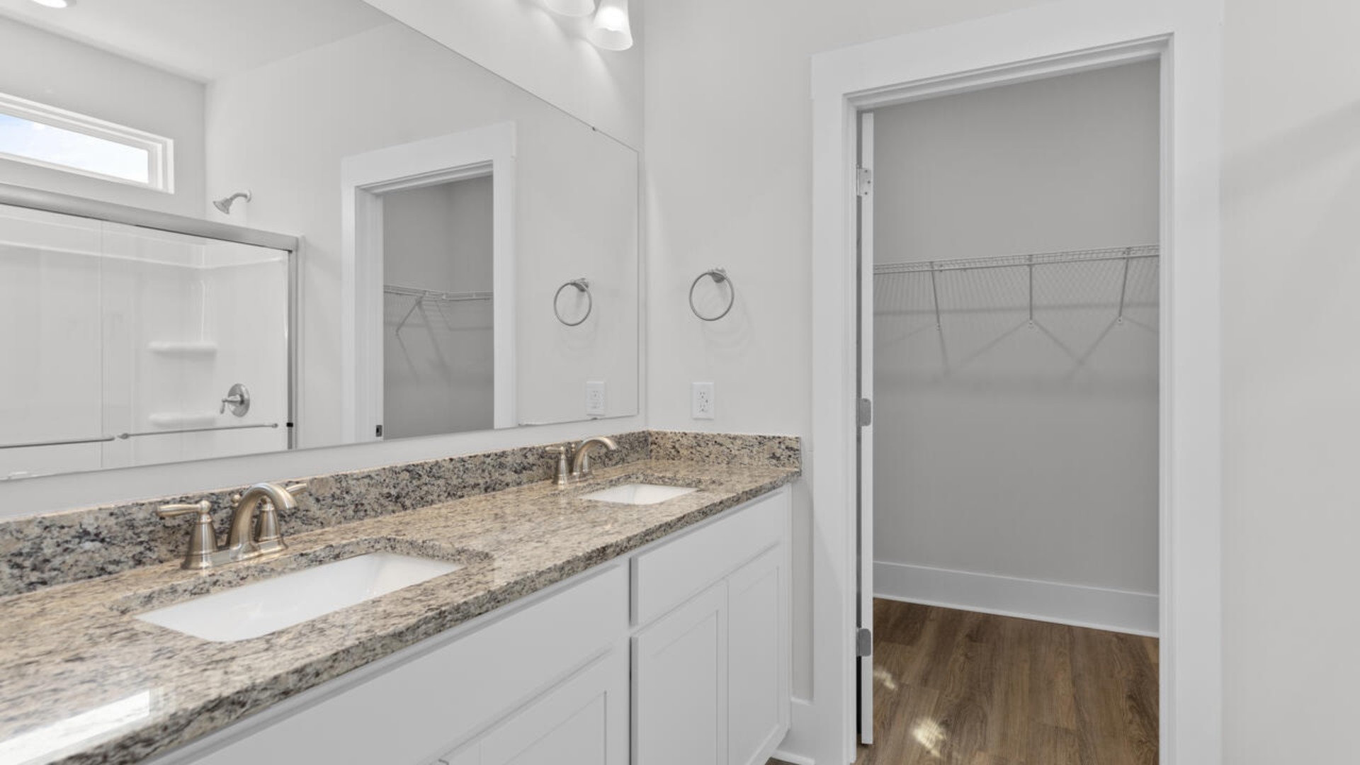 The primary bedroom has its own attached bathroom that features a walk-in closet and all the space you need to get ready in the morning.