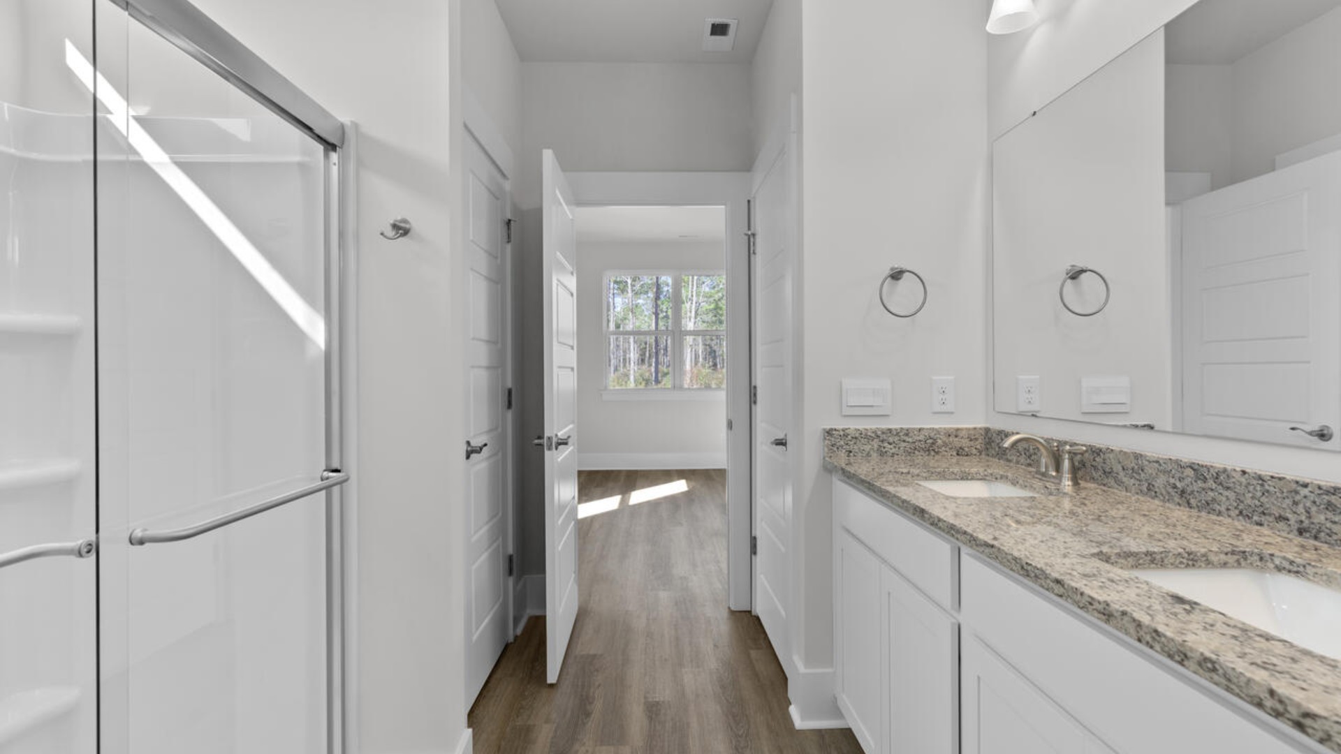 The primary bedroom has its own attached bathroom that features a walk-in closet and all the space you need to get ready in the morning.