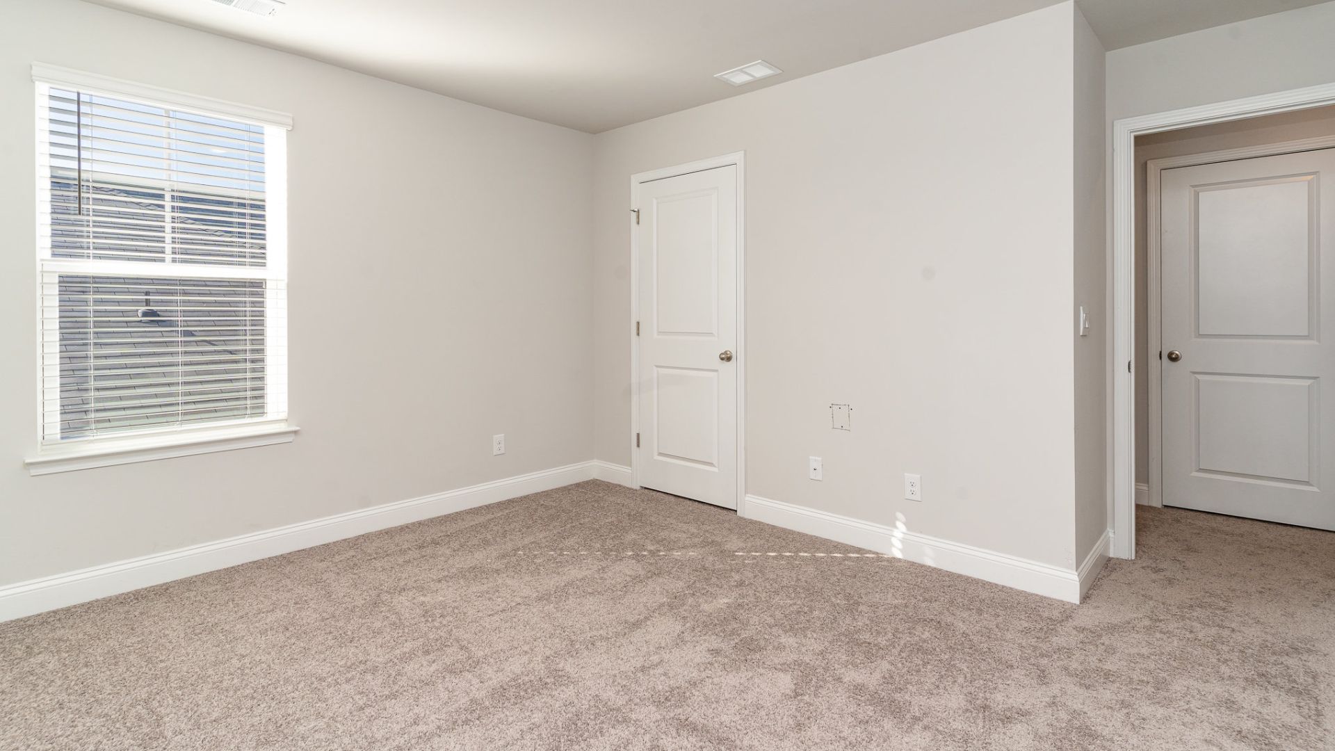 The primary bedroom has its own attached bathroom that features a walk-in closet and all the space you need to get ready in the morning. Sharing a sink isn’t a worry with the double vanity, and you also get additional privacy with a separate door for the toilet and shower.