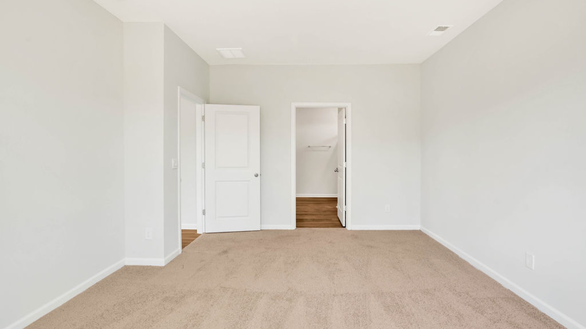 Situated entirely at the rear of the home for optimal isolation, complete with dual vanities, a large walk-in shower, and a walk-in closet.