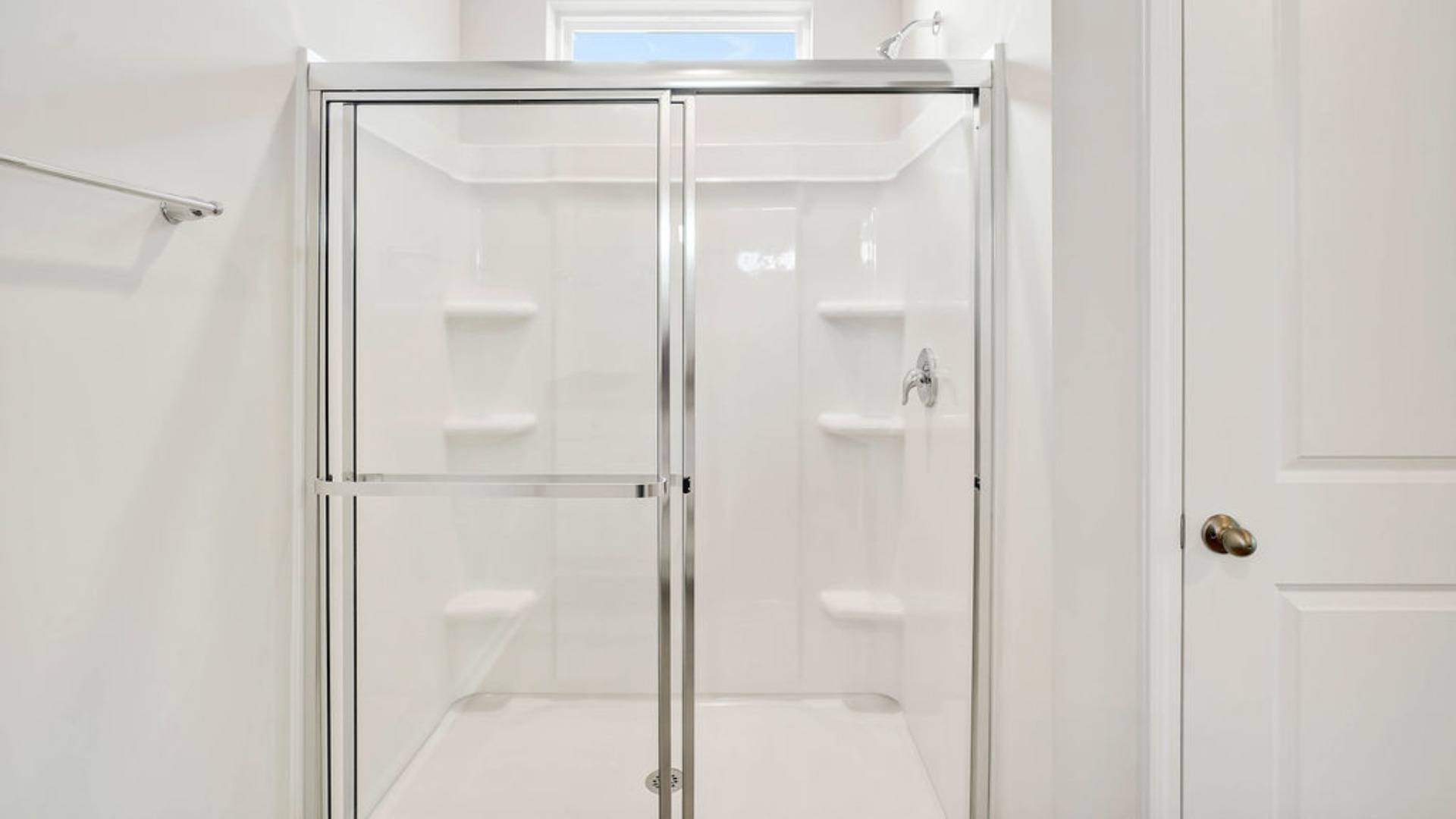 Situated entirely at the rear of the home for optimal isolation, complete with dual vanities, a large walk-in shower, and a walk-in closet.