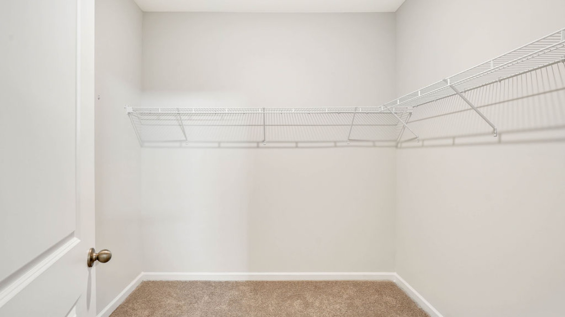 Situated entirely at the rear of the home for optimal isolation, complete with dual vanities, a large walk-in shower, and a walk-in closet.