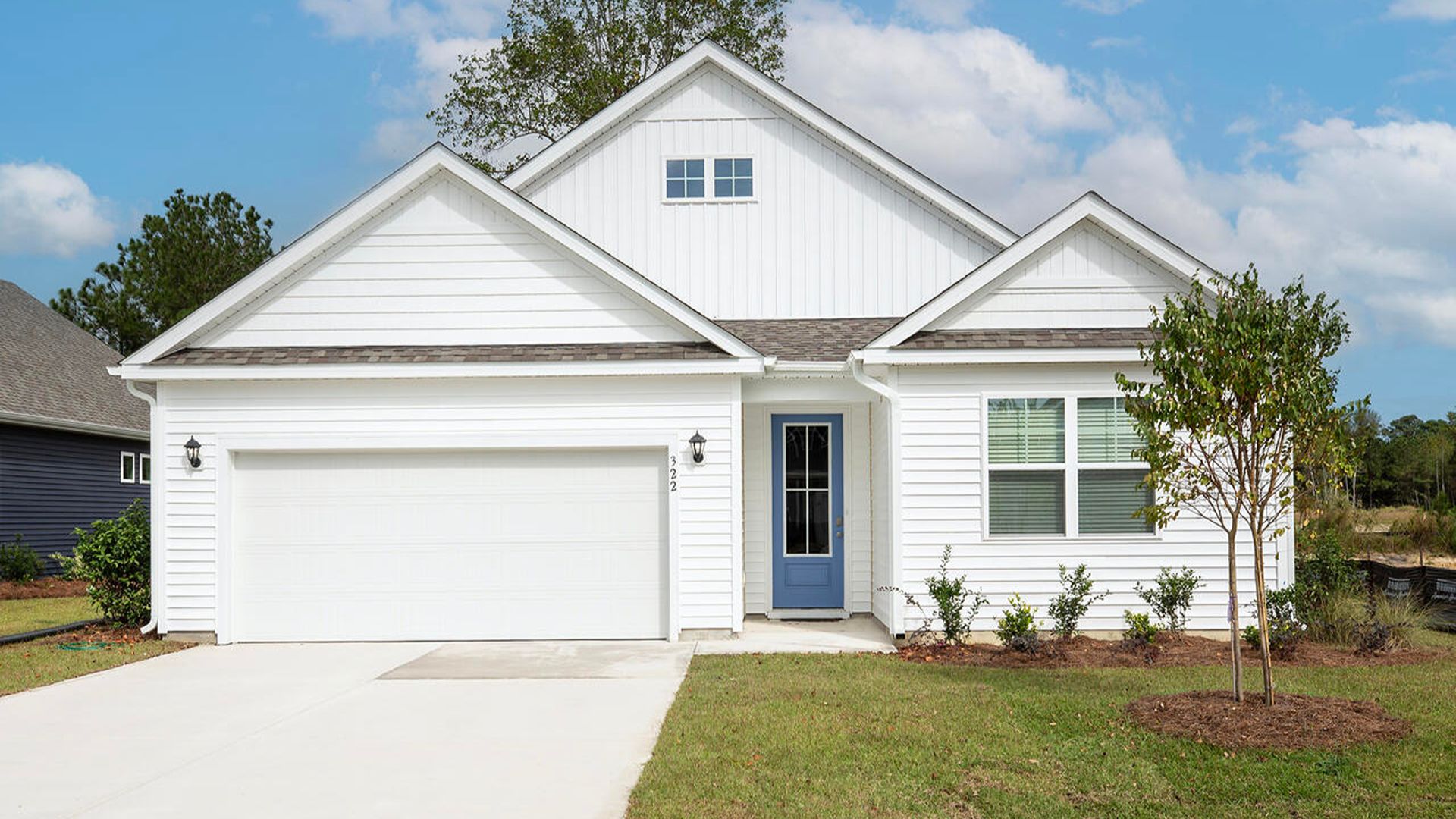 The Darby Plan in Grayson Park located in Leland, North Carolina a beautiful home is 2,671 sq ft with 5 bedrooms,3 baths, a back porch, and a two-car garage. The ground level balances privacy with an open, airy flow: