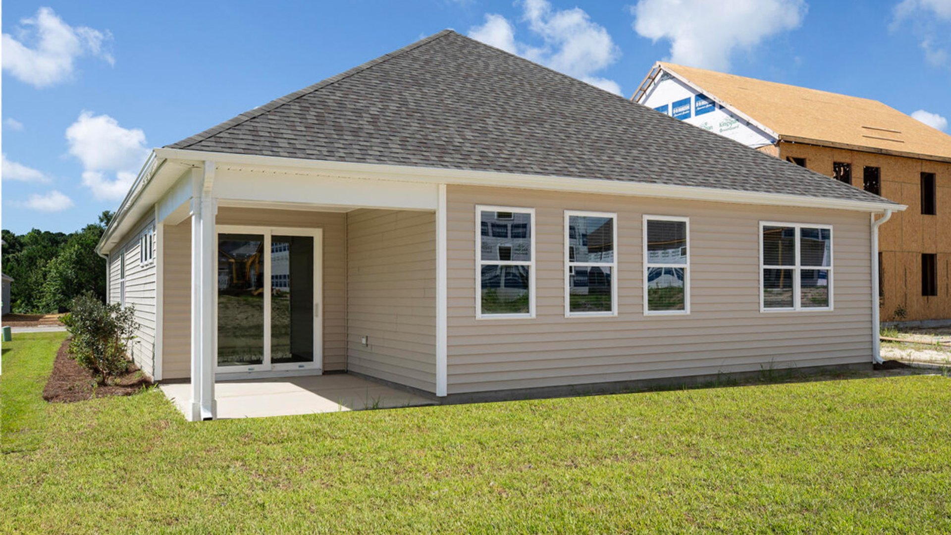 4 panel glass sliding doors open onto large covered porch a perfect spot to start the day or end the evening.