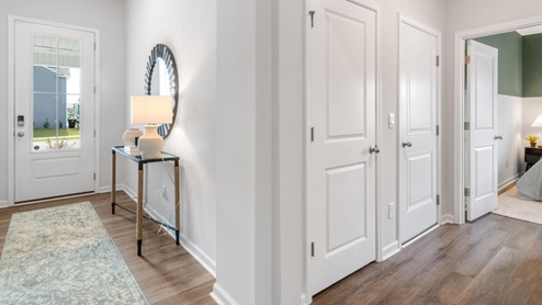 The Litchfield plan is a perfect home for beach living and entertaining. Completely open floor plan, 11-foot-high ceiling, and a large gourmet kitchen
