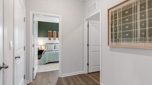 The Litchfield plan is a perfect home for beach living and entertaining. Completely open floor plan, 11-foot-high ceiling, and a large gourmet kitchen