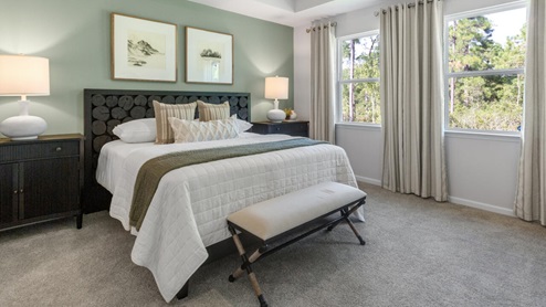 . The primary suite features a step-in 5-foot shower and dual vanity. 4 panel glass sliding doors open onto large covered porch