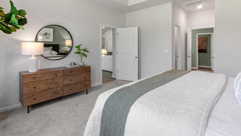 . The primary suite features a step-in 5-foot shower and dual vanity. 4 panel glass sliding doors open onto large covered porch